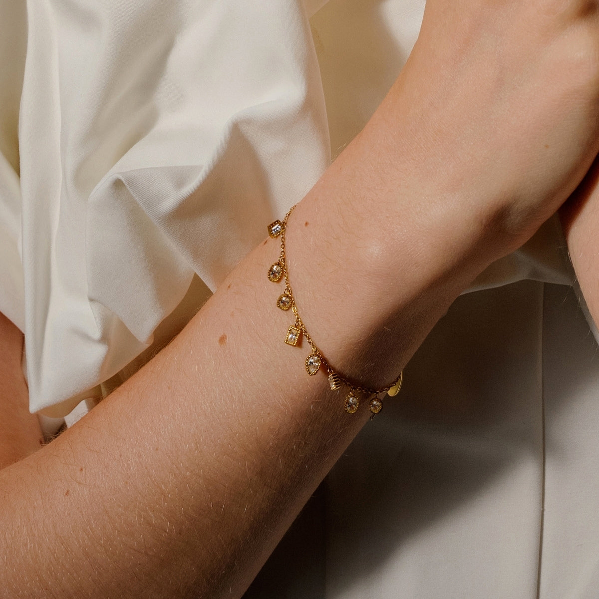 Top and side of AEC Paris Isha white zirconium oxide bracelet on woman's wrist