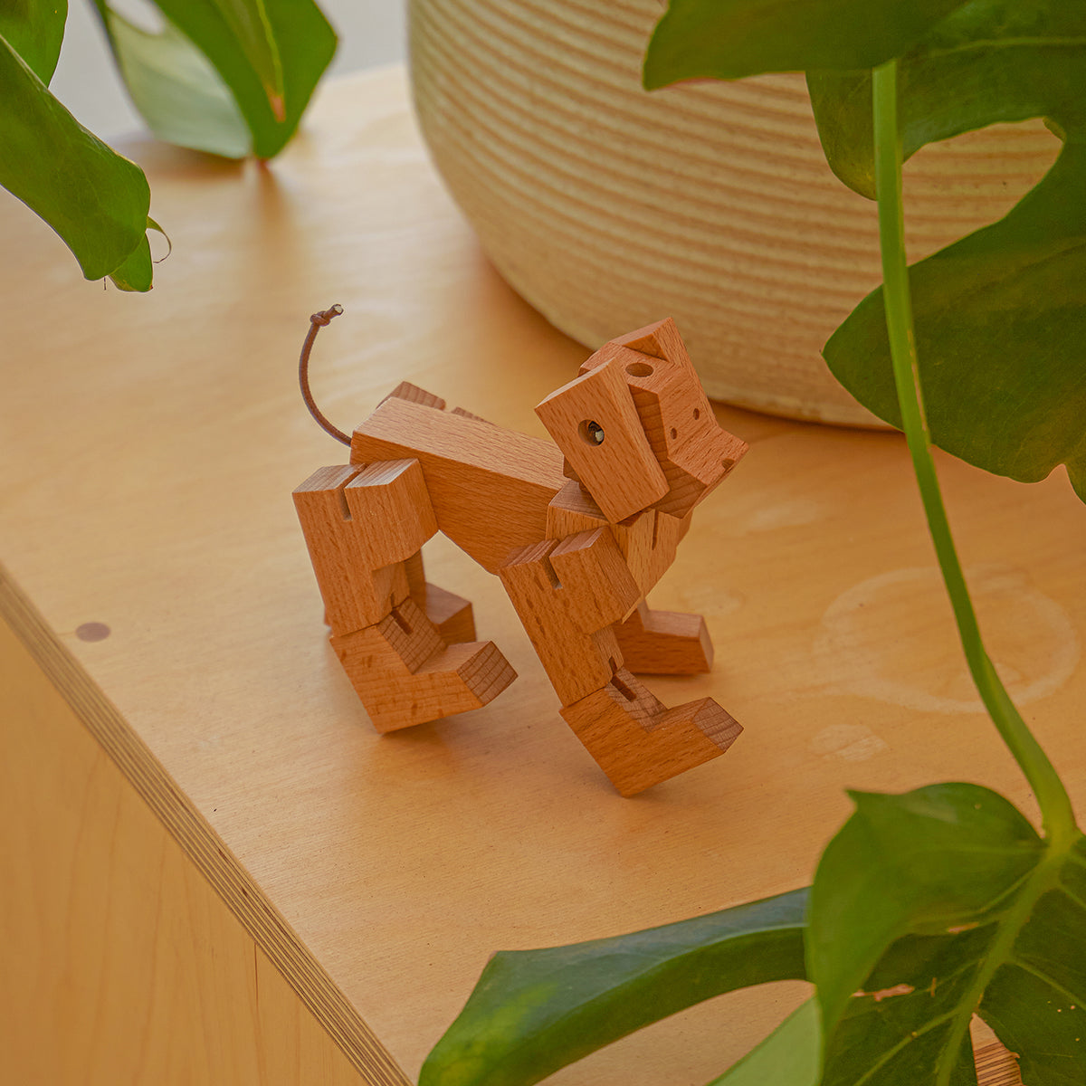 Cubebot milo micro natural standing on wooden table under plant