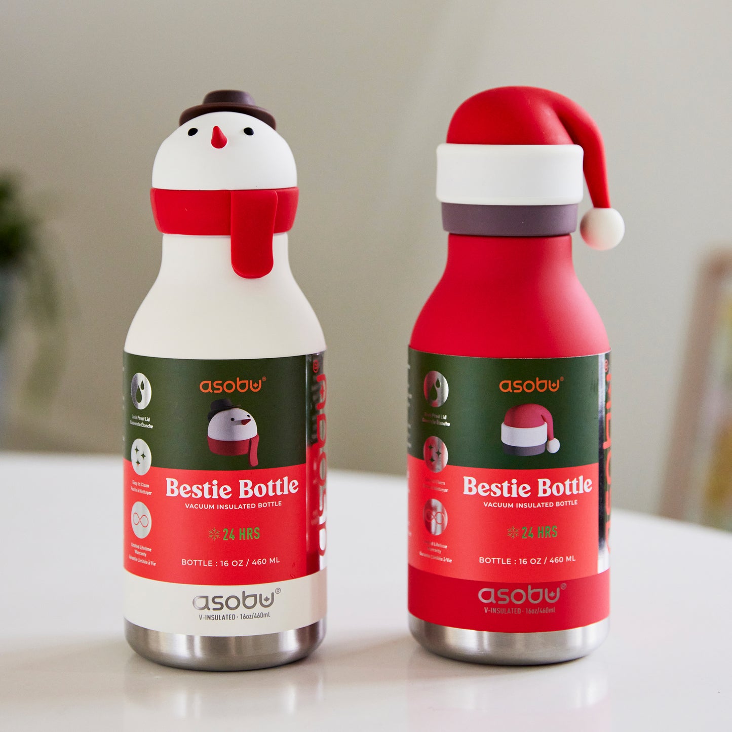 Front view of Santa Bestie Bottle by Asobu showing packaging and matching snowman bottle
