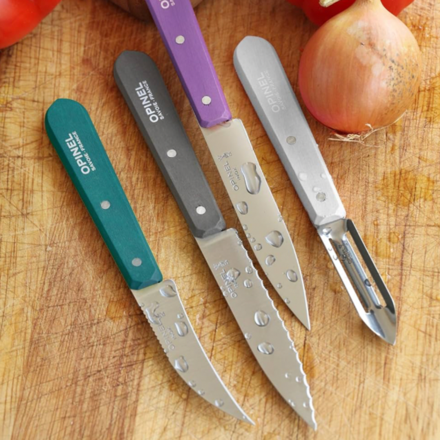 Opinel Les Essentiels Kitchen Knife Set SS Art Deco in kitchen with chopping board and onion