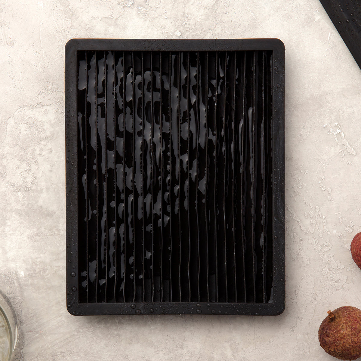 Close up of WP crushed ice cube tray with ice on white background