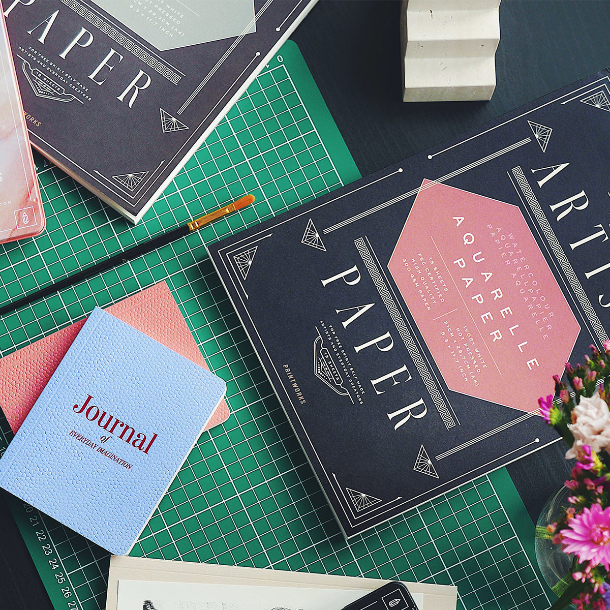 Printworks aquarelle artist paper on black desks with other books