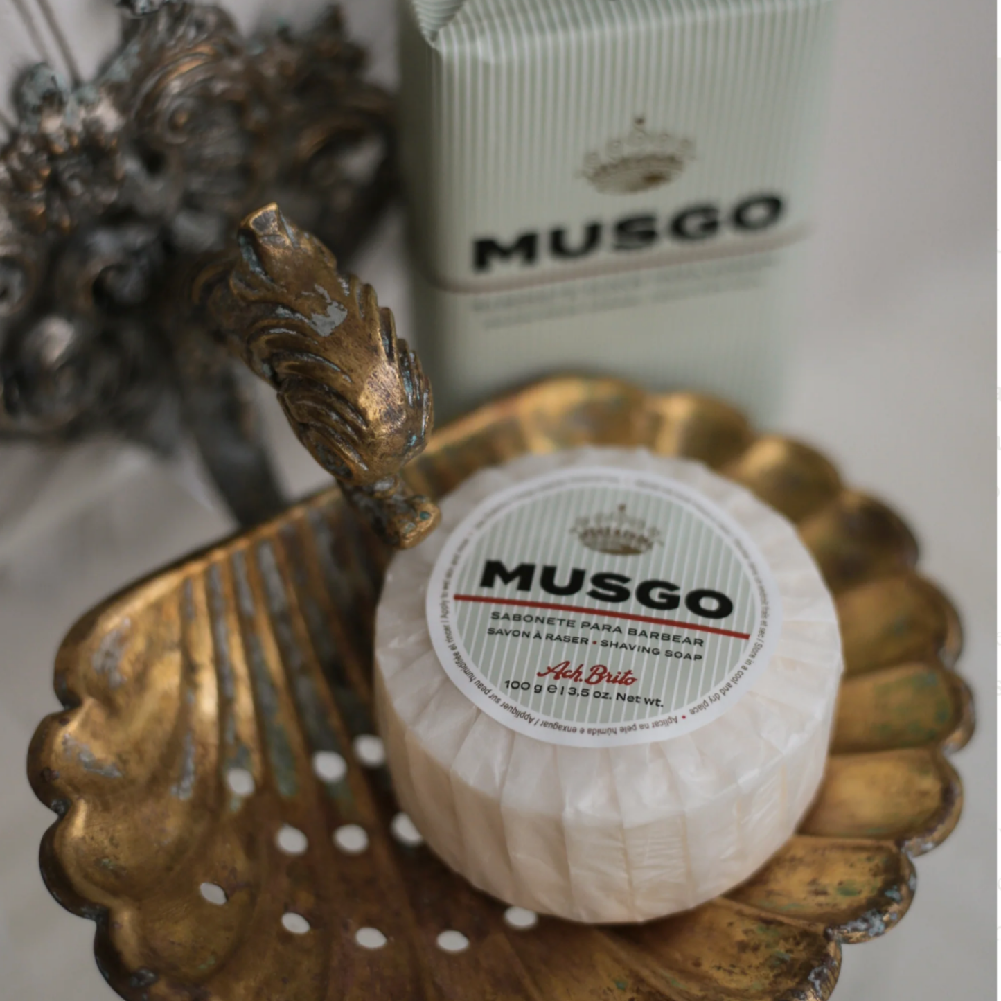 Ach Brito Musgo shaving soap 100g in packaging wrapping on ornate brass soap dish