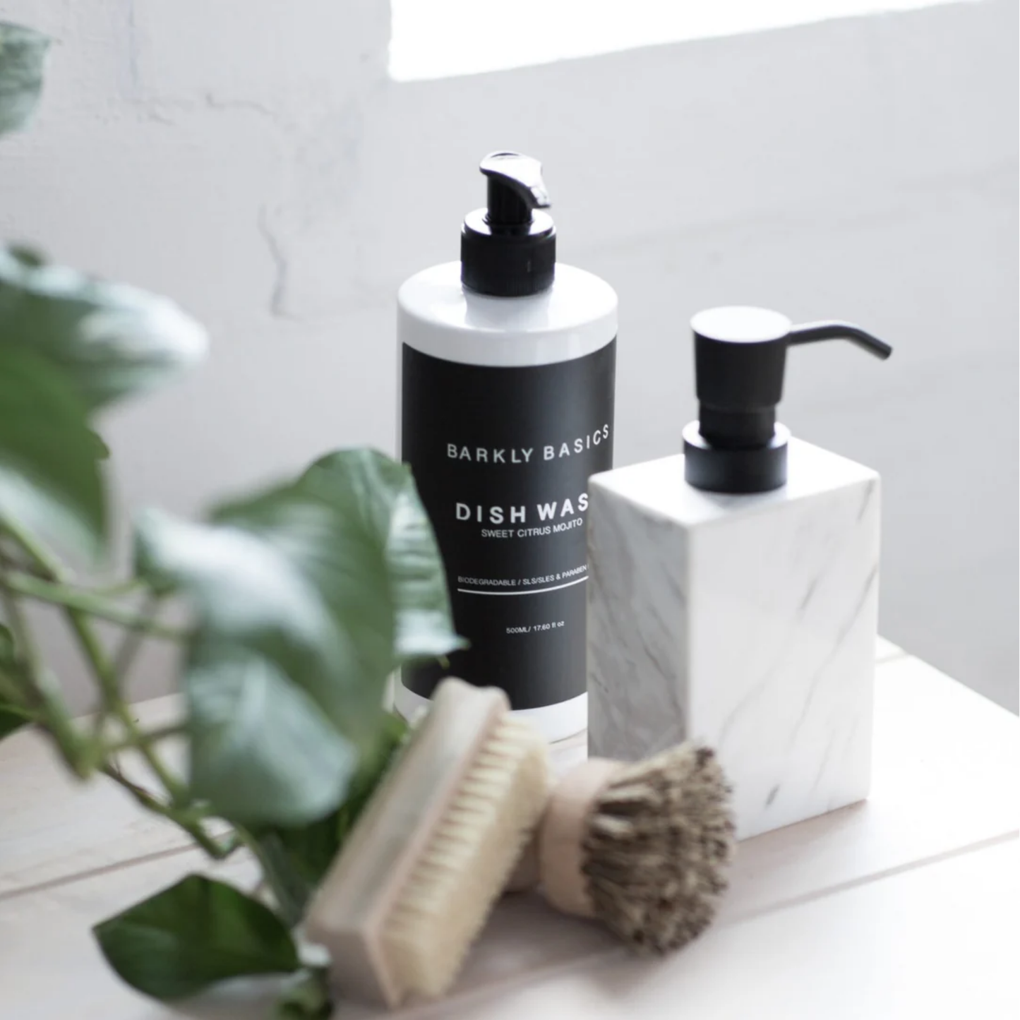 Barkly Basics dish wash on display on kitchen counter near sink with scrubbing brushes