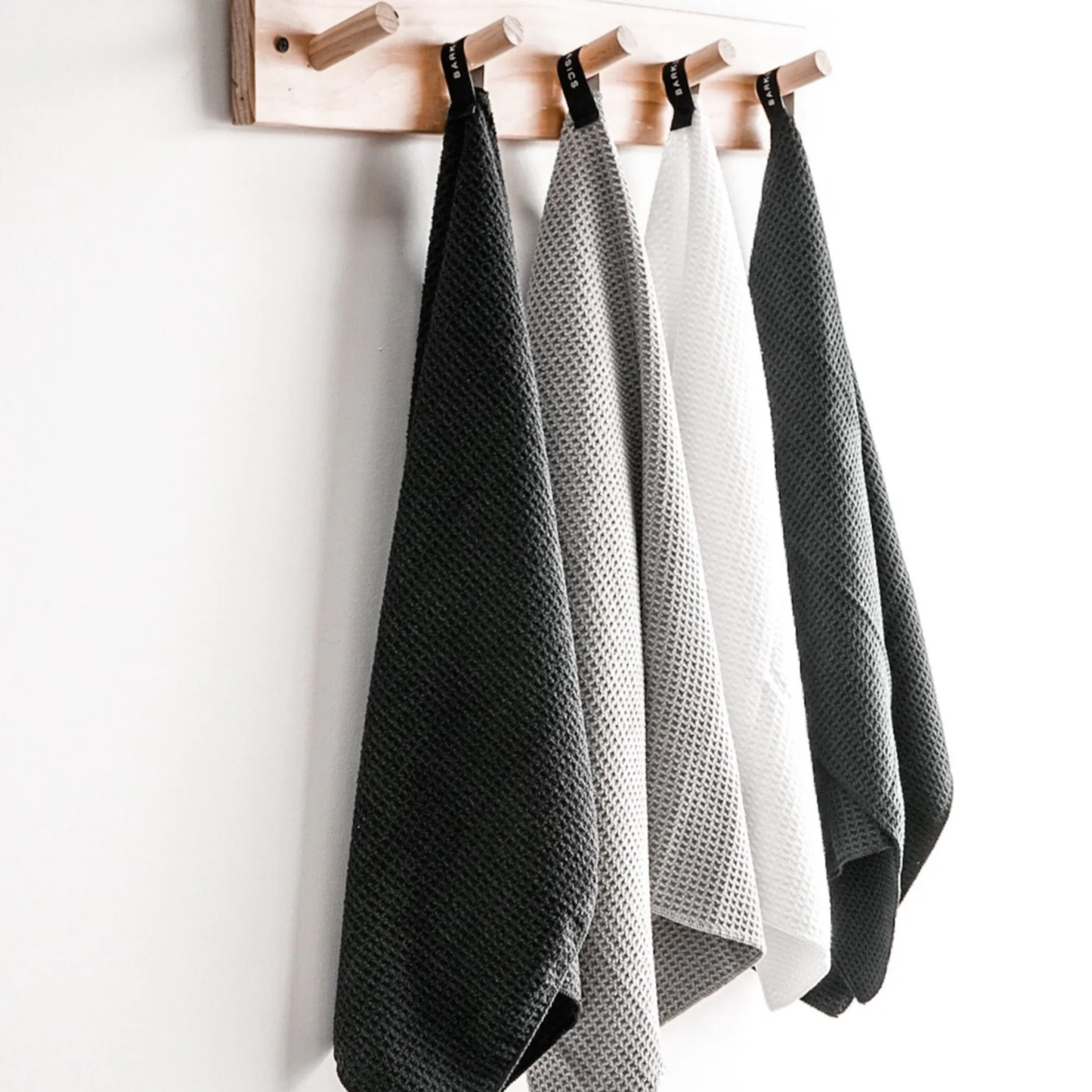 Barkly Basics microfibre towel white on display in hanging rack with other microfibre towels