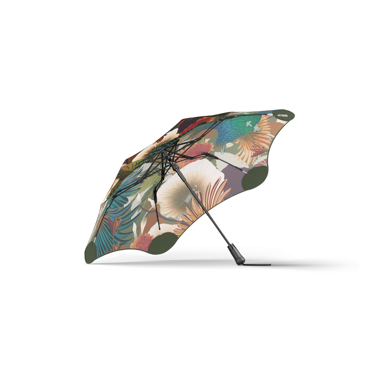 Side view showing the inner side of the Blunt Umbrella Metro Flox that is bird and flowers, which is compact, collapsible and convenient, consisting of the detachable UV fabric canopy, sturdy frame, shaft and handle. Fits in your handbag, tote or backpack. Built for fast living, those who travel light, and any weather.
