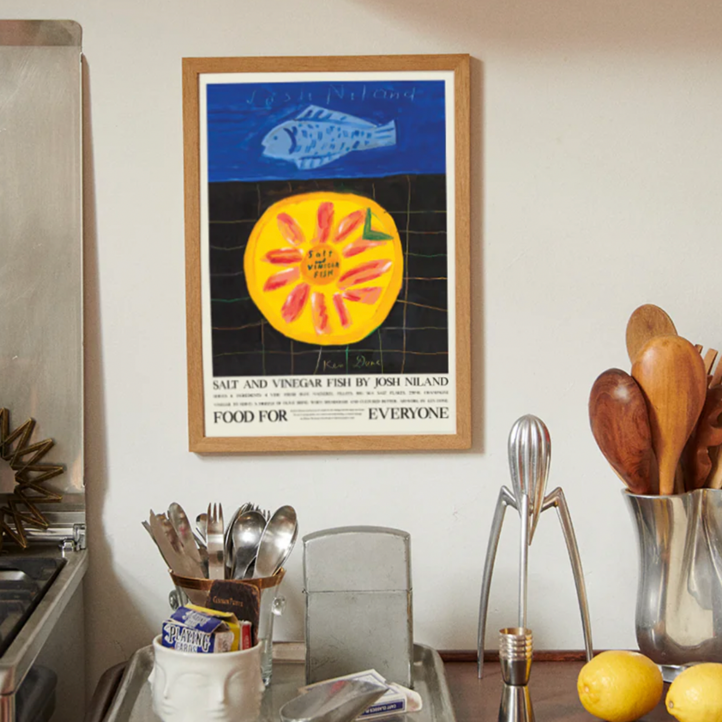 Food For Everyone Salt and Vinegar Fish artwork A2 front view in frame hanging in kitchen next to stove