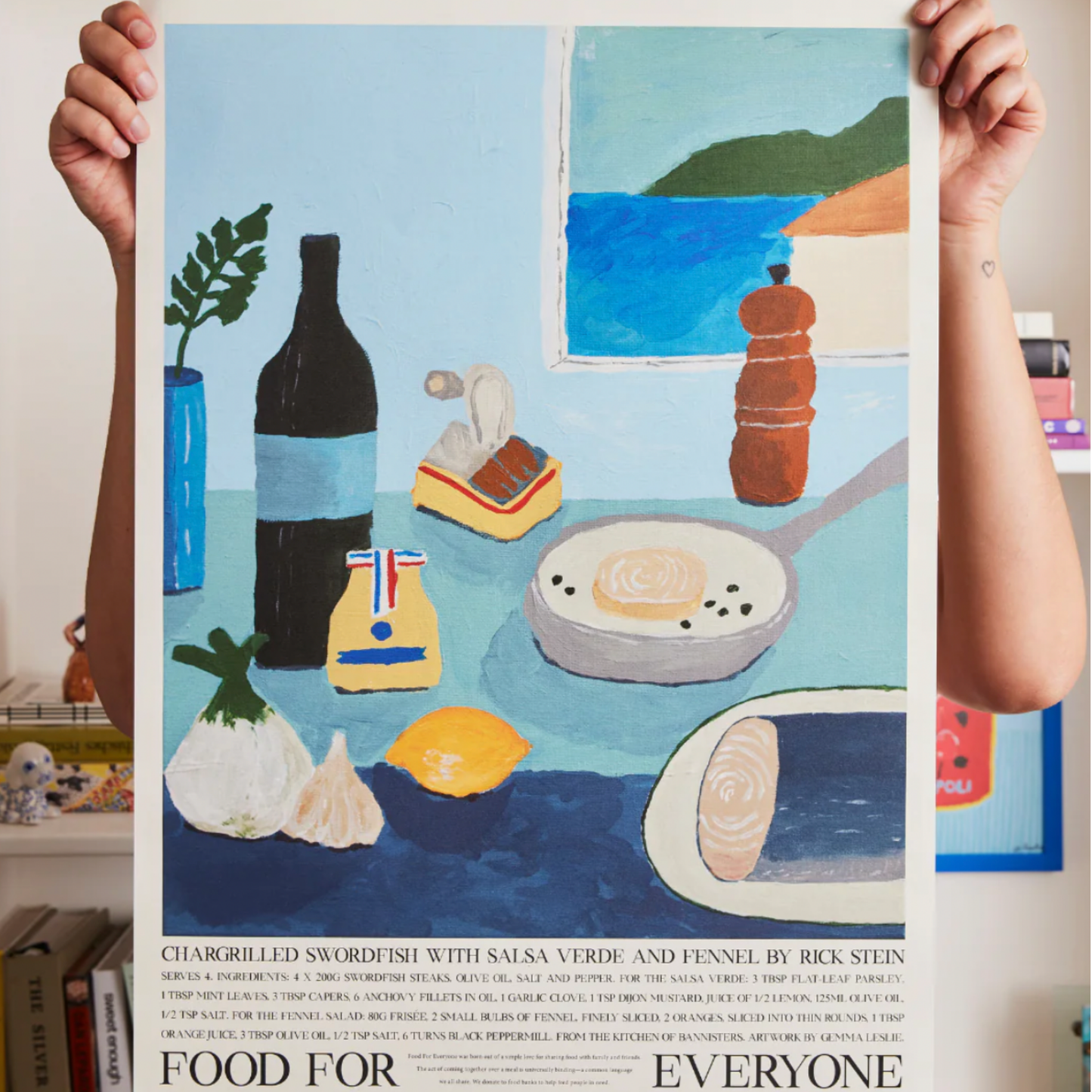 Woman holding Food For Everyone Pour Over at Home artwork A2 front view out of frame hanging in kitchen