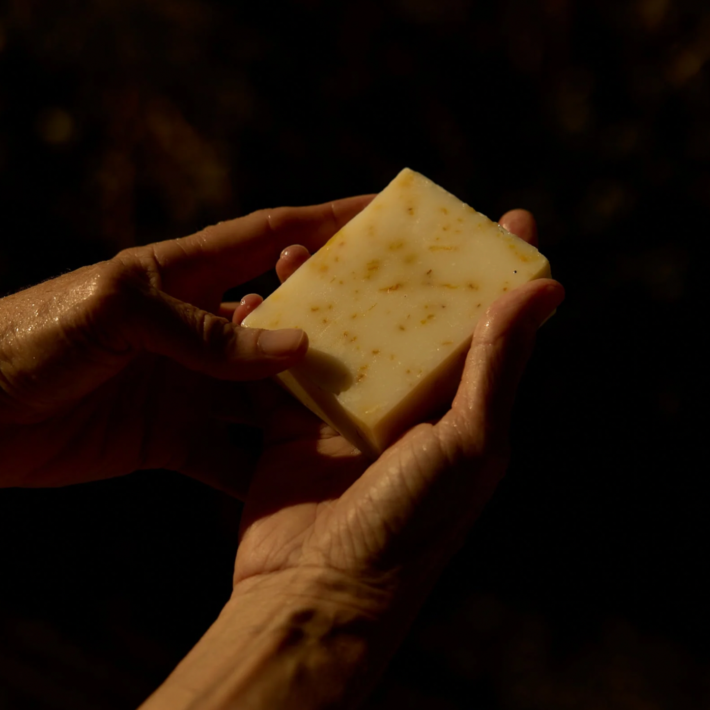 Woman using Herb Remedy botanical soap bar Calendula to wash hands