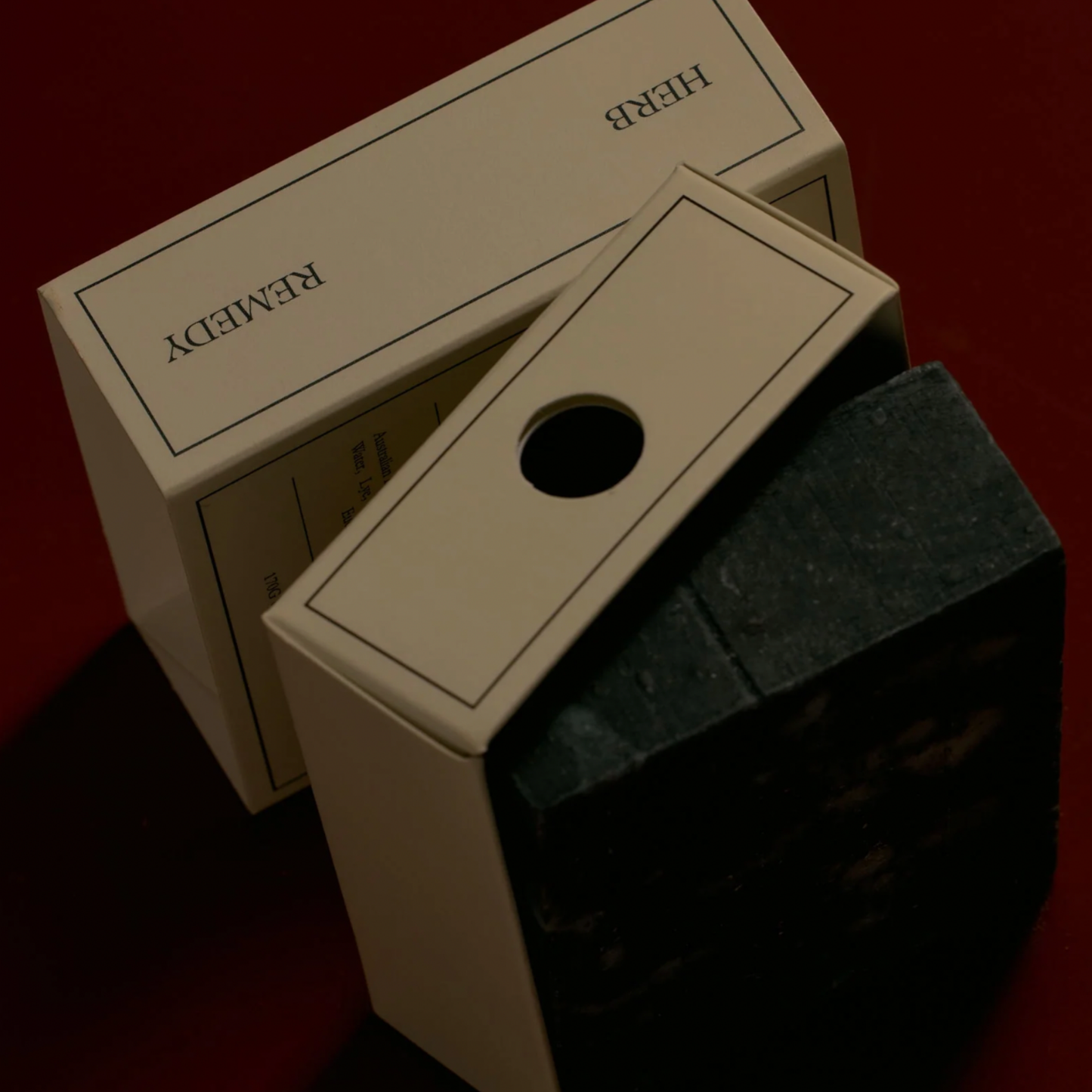 Herb Remedy Eucalyprus soap half unpackaged in moody lighting