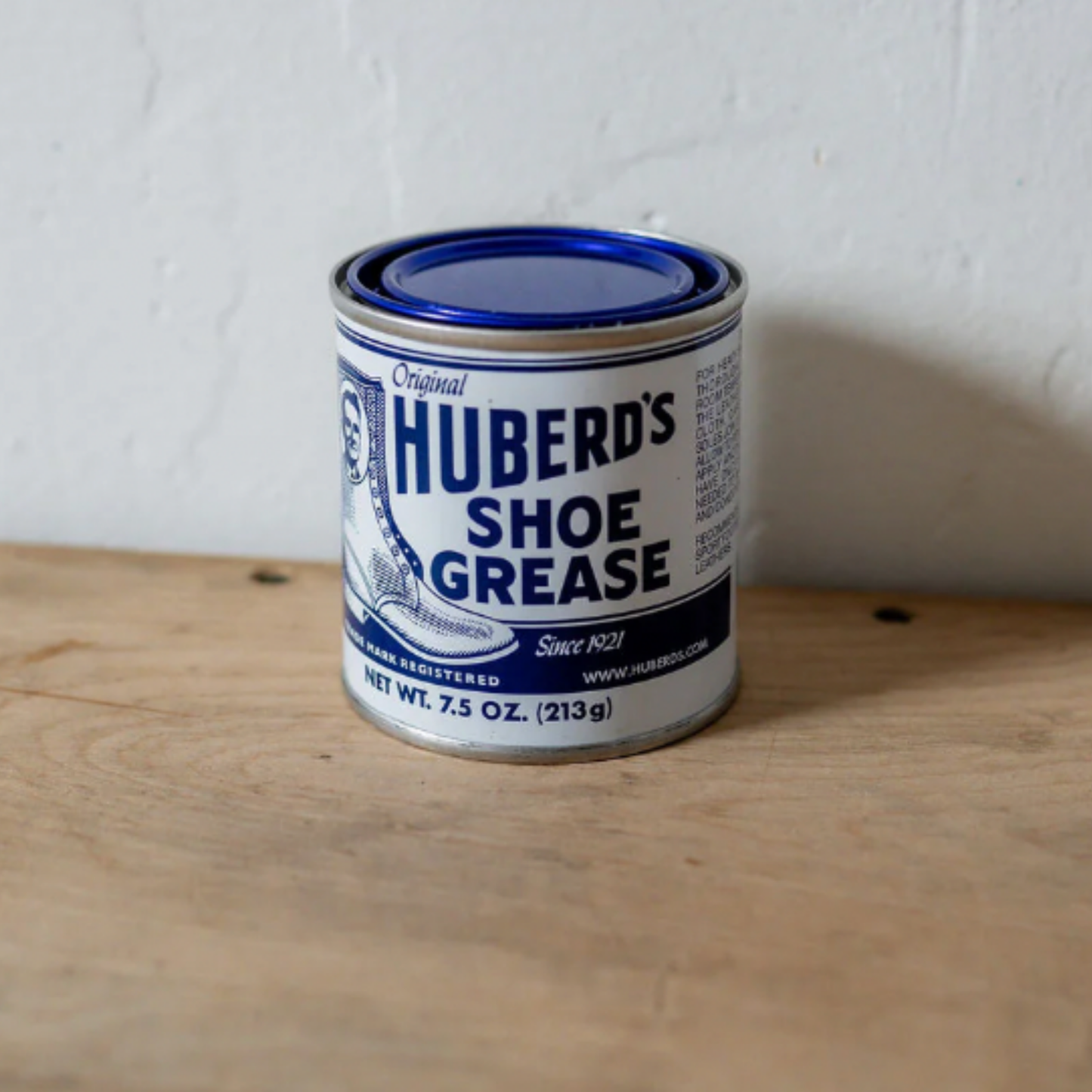 Huberds shoe greese can on display on wooden table