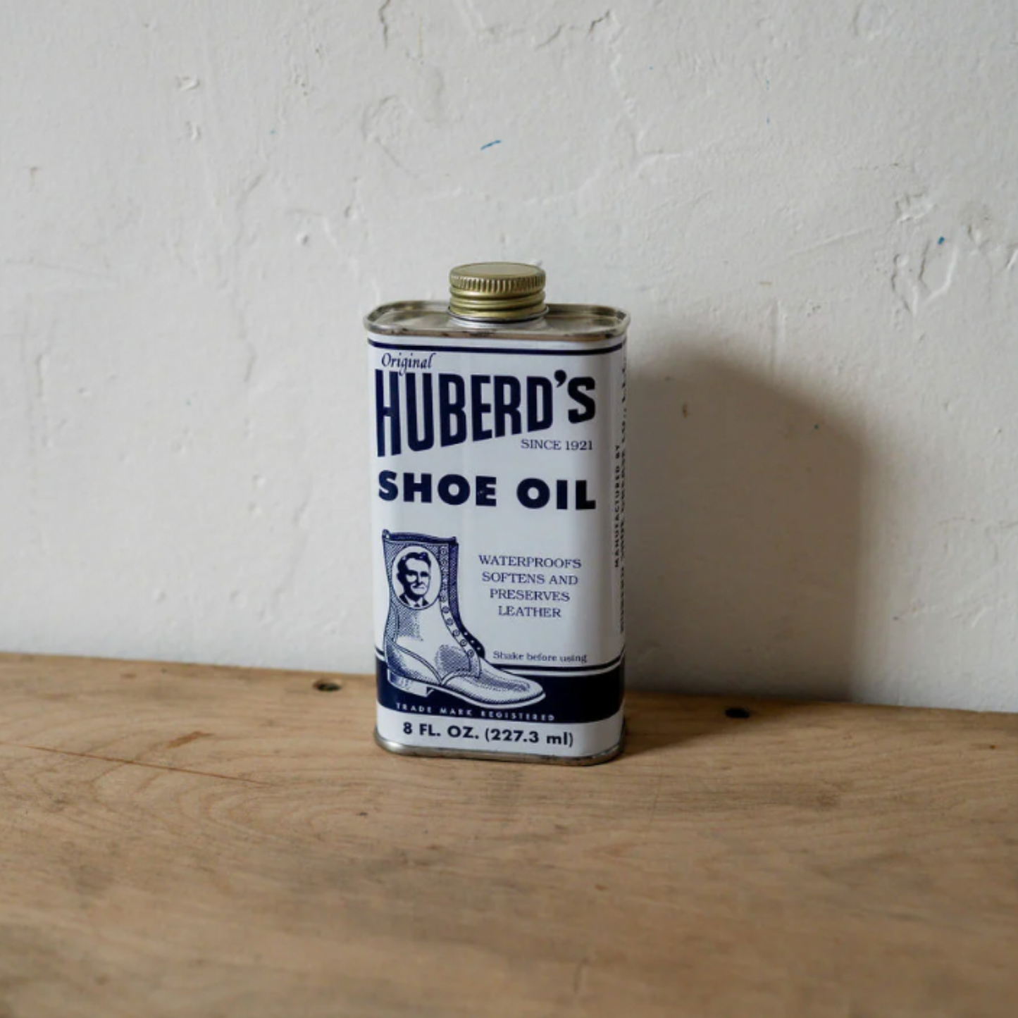 Huberds shoe oil can on display on wooden table