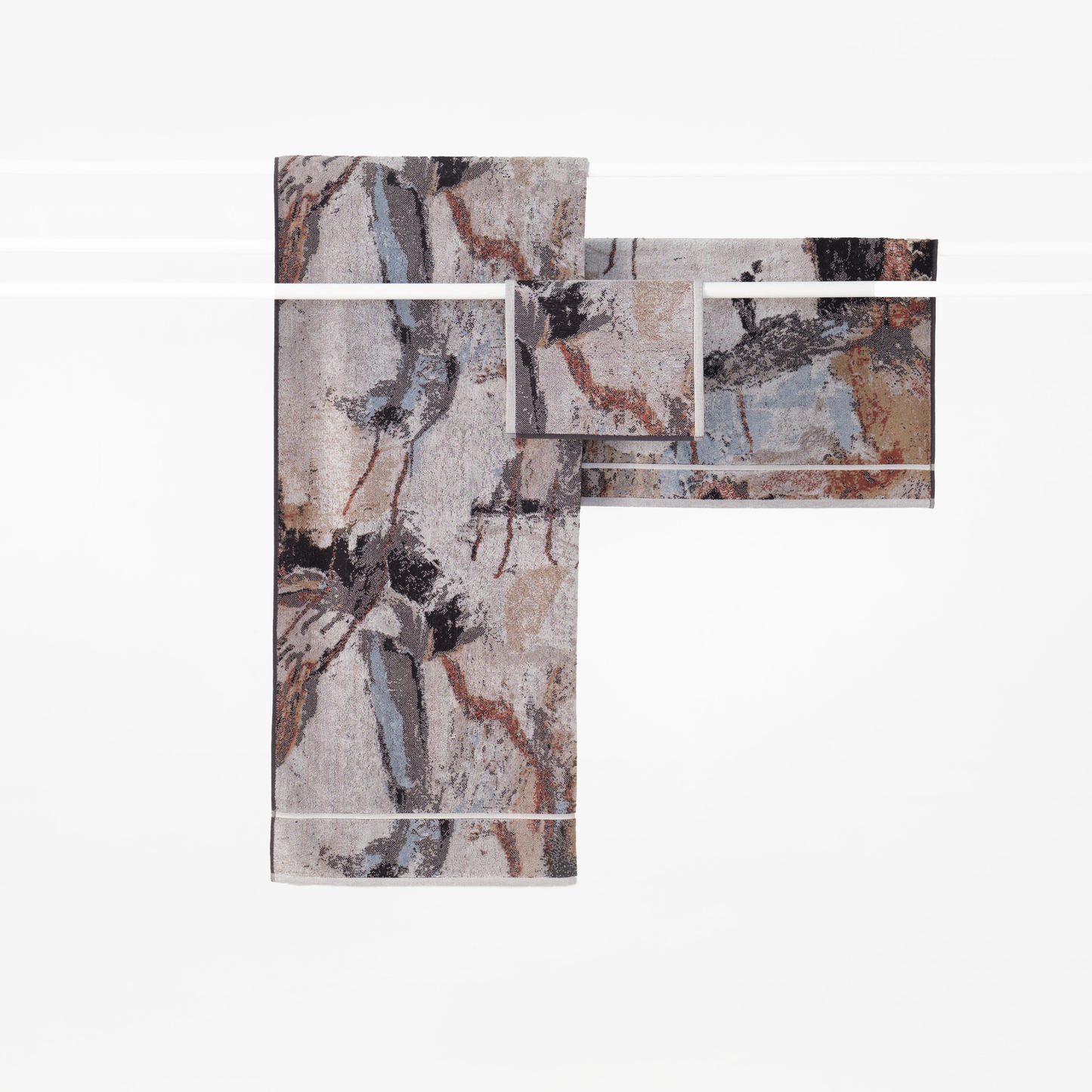 The Innate NT Morning Guest Towel 30cm x 50cm, with the bath sheet and mat. A Guest towel in warm earthy tones inspired by Australia's Top End landscape, made from 100% OEKO-TEX® certified cotton, featuring an absorbent six-colour jacquard weave with rich texture and weight, responsibly woven in Portugal for everyday premium use.