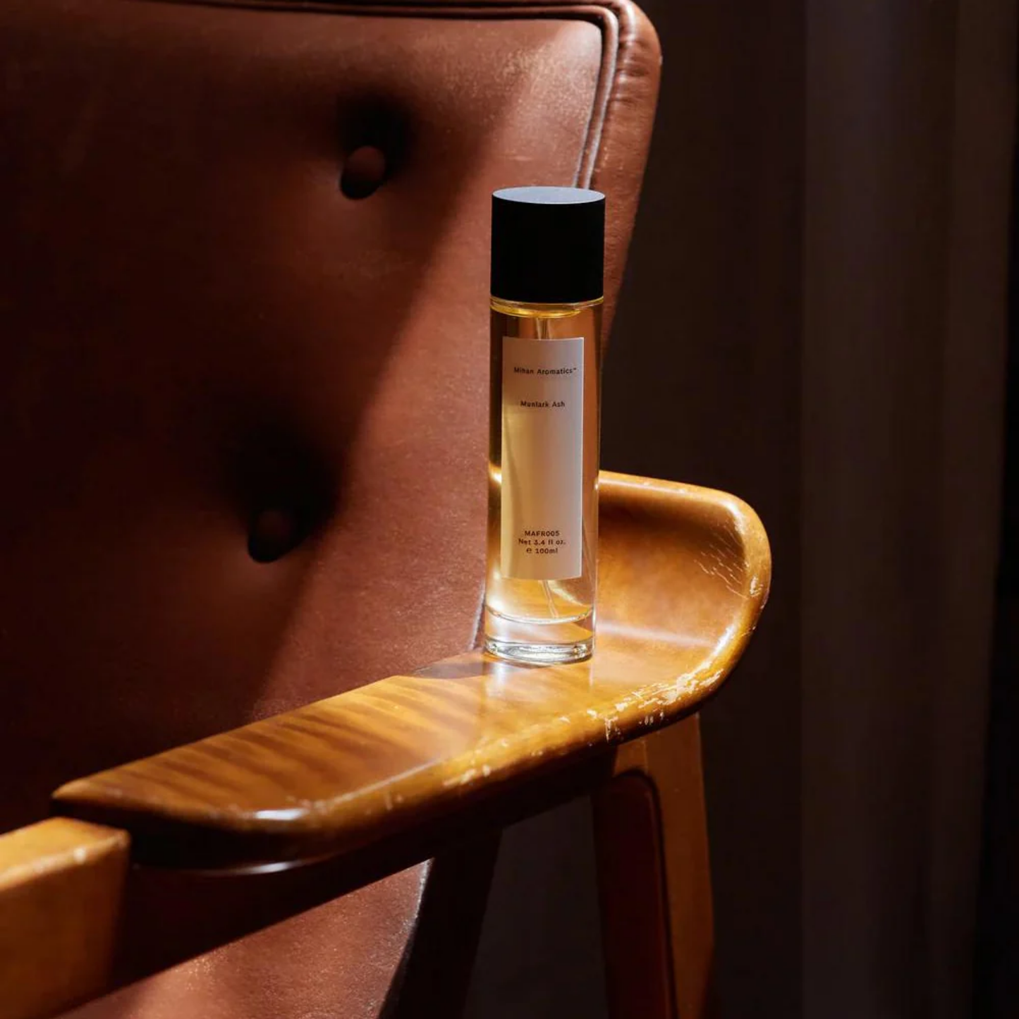 Mihan Aromatics 100ml Munlark Ash on arm chair arm in sunlight