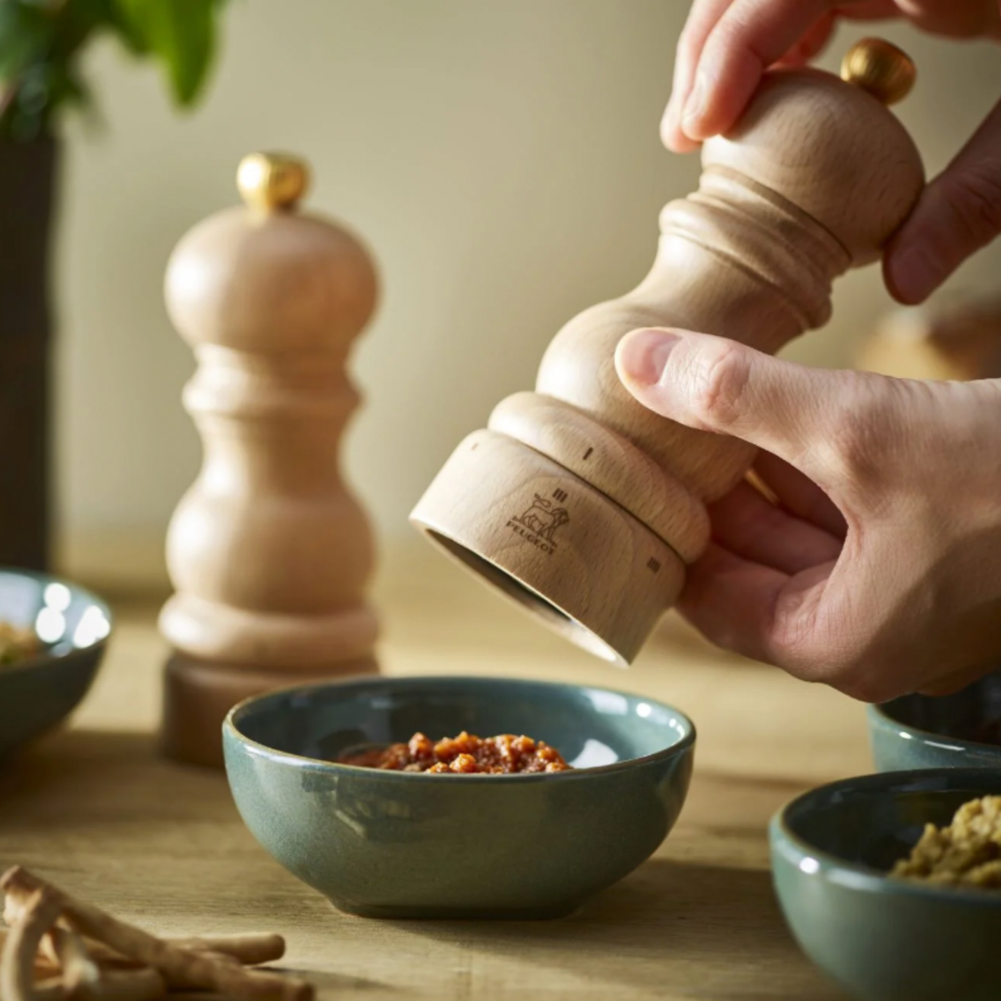 Woman seasoning dishes with Paris uSelect Salt Mill 18cm Natural