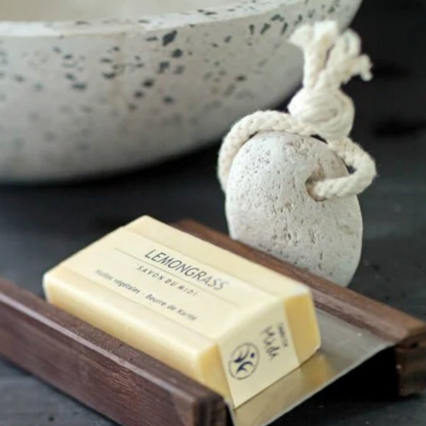 Redecker hamman pummice stone with chord loop on display in bathroom with lemongrass soap
