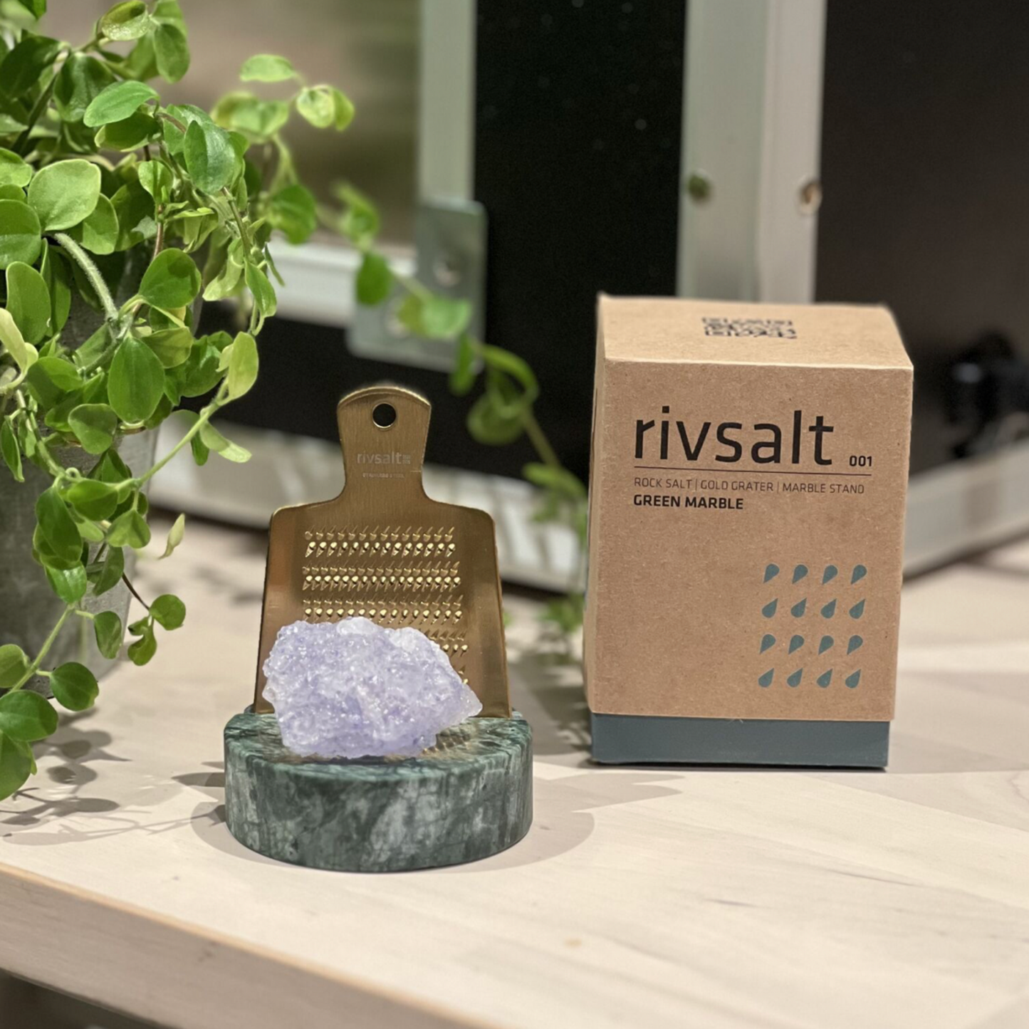 The Original Rivsalt Green Marble next to packaging box on countertop