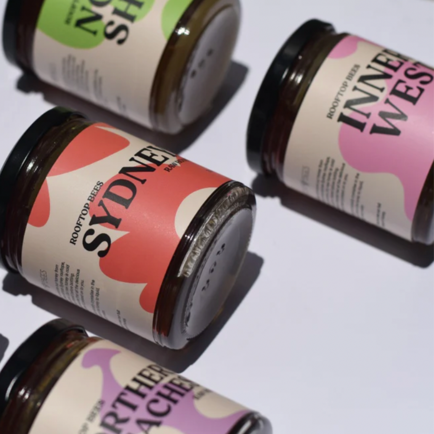 Assorted jars of Rooftop Bees raw honey including Inner West raw honey