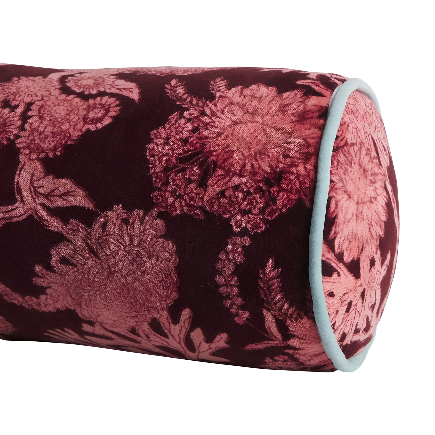 Close up on the side view of the Sage & Clare Cushion Bolster Velvet Delphine that has a soft touch, piping edges and high quality insert.