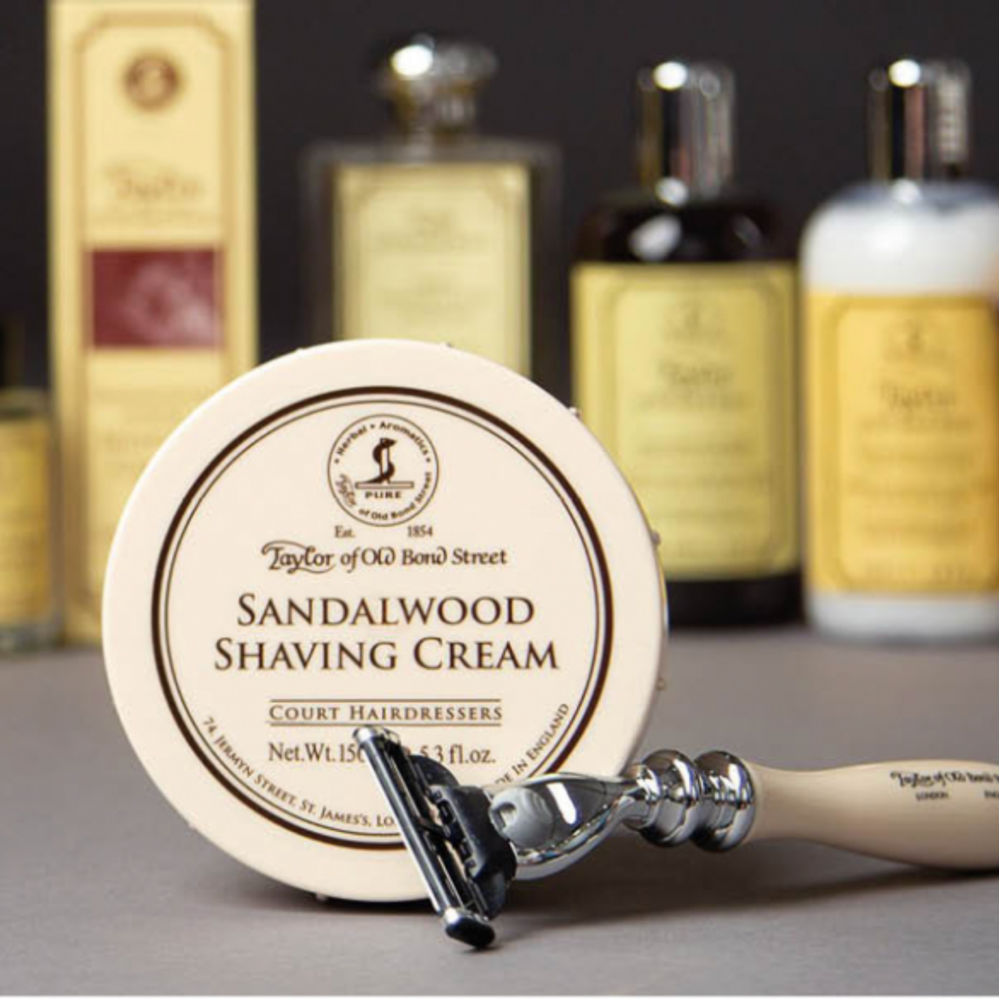 Assorted Taylor of Old Bond Street products on display with Shaving Cream Bowl 150g Sandalwood at foreground