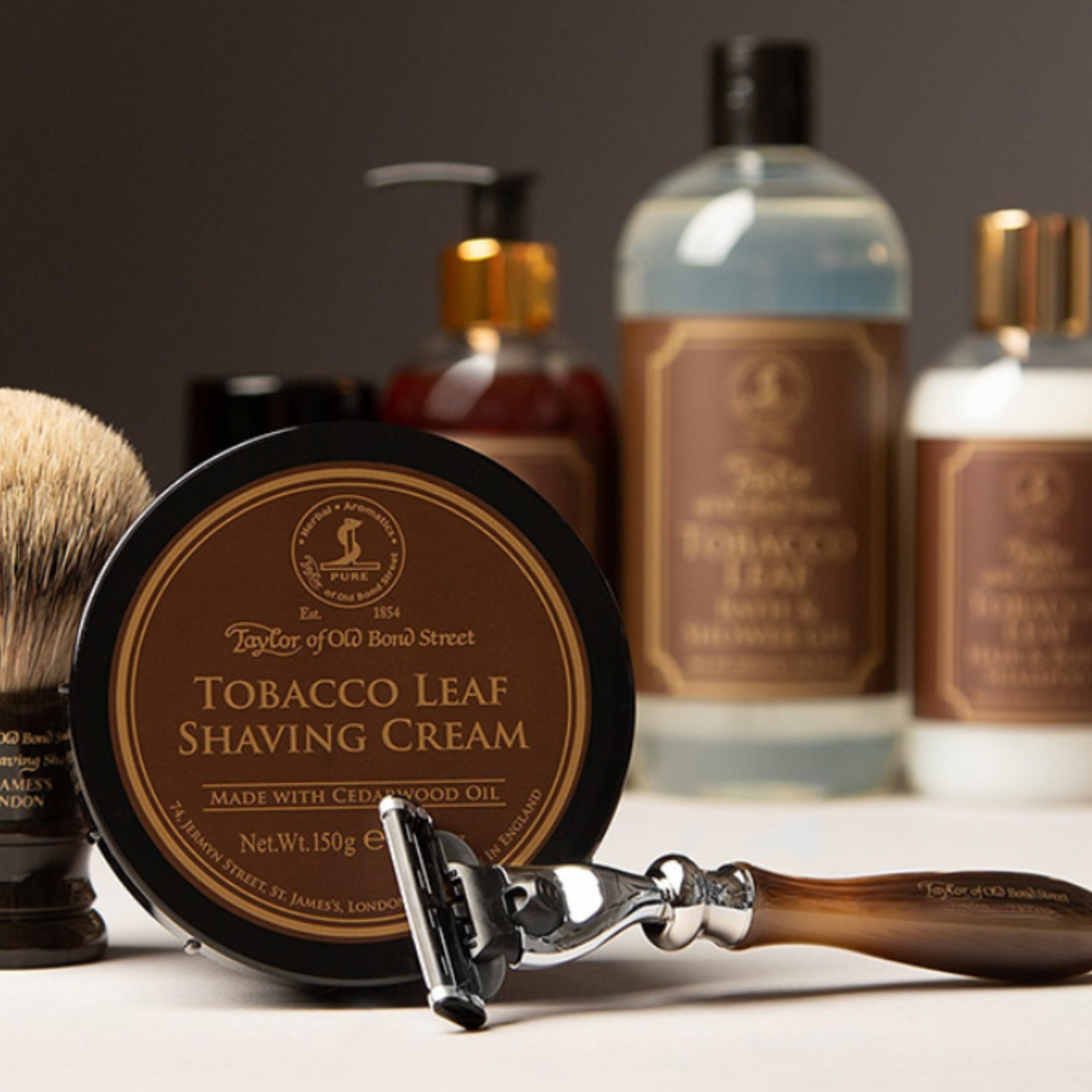 Assorted Taylor of Old Bond Street products on display with Shaving Cream Bowl 150g Tobacco Leaf at foreground