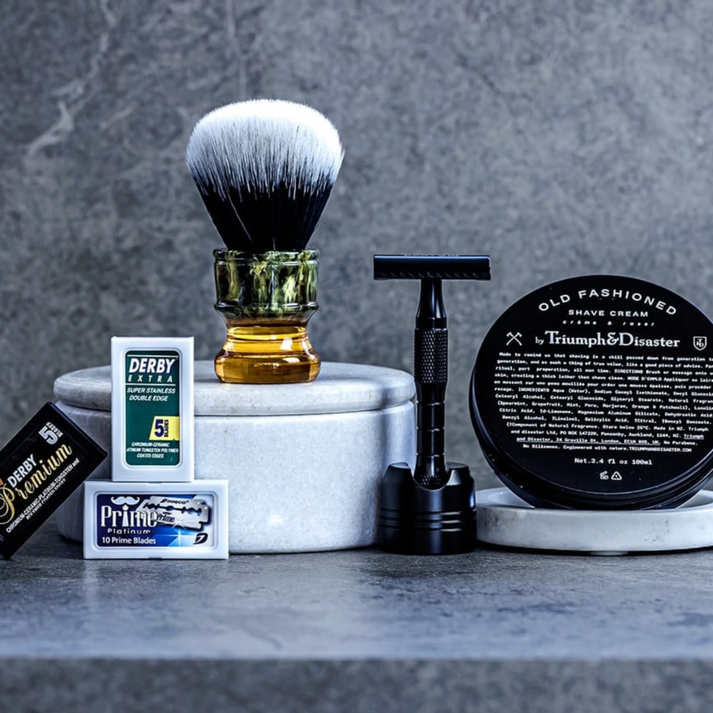 assorted shaving accessories in bathroom on display with Yaqi Shaving Brush Synthetic Sagrada Familia