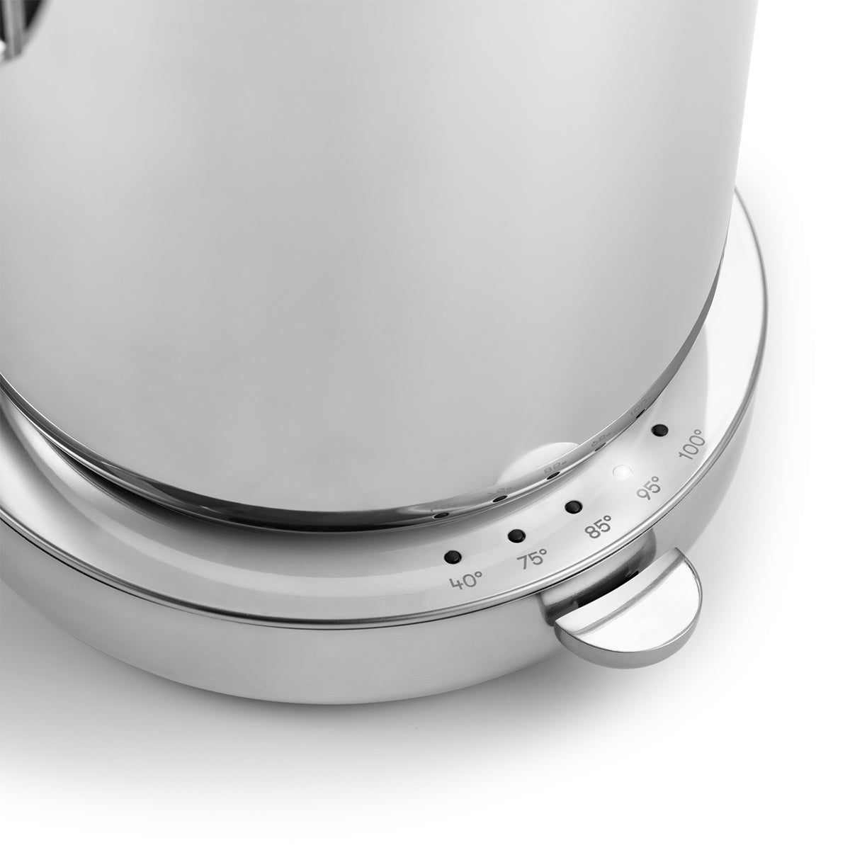Close up of stylish modern kettle made from stainless steel and designed in Sweden by Aarke with polished finish showing the base with tempurature control
