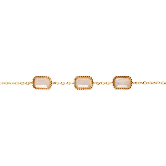 Close up of 3 moonstones on AEC Paris Eurybie bracelet in straight line on white background