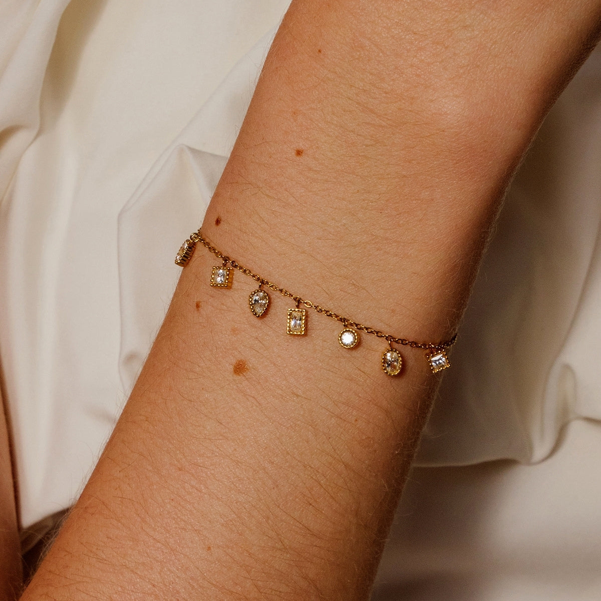 AEC Paris Isha white zirconium oxide bracelet showing top side on woman's wrist