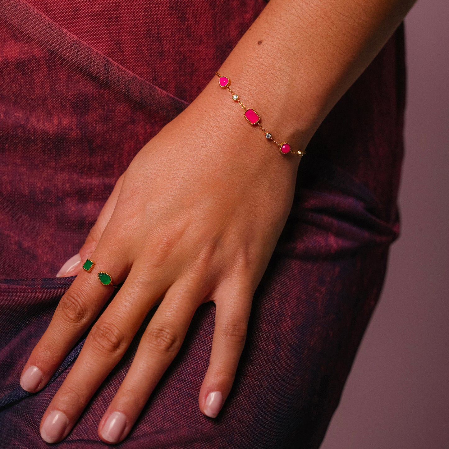 Bracelet on the wrist from AEC Paris Pelagia bracelet - 14k gold-plated stainless steel chain bracelet with six rose agate stones and cubic zirconia accents, pink and gold tones, hypoallergenic durable materials featuring natural stone variations.