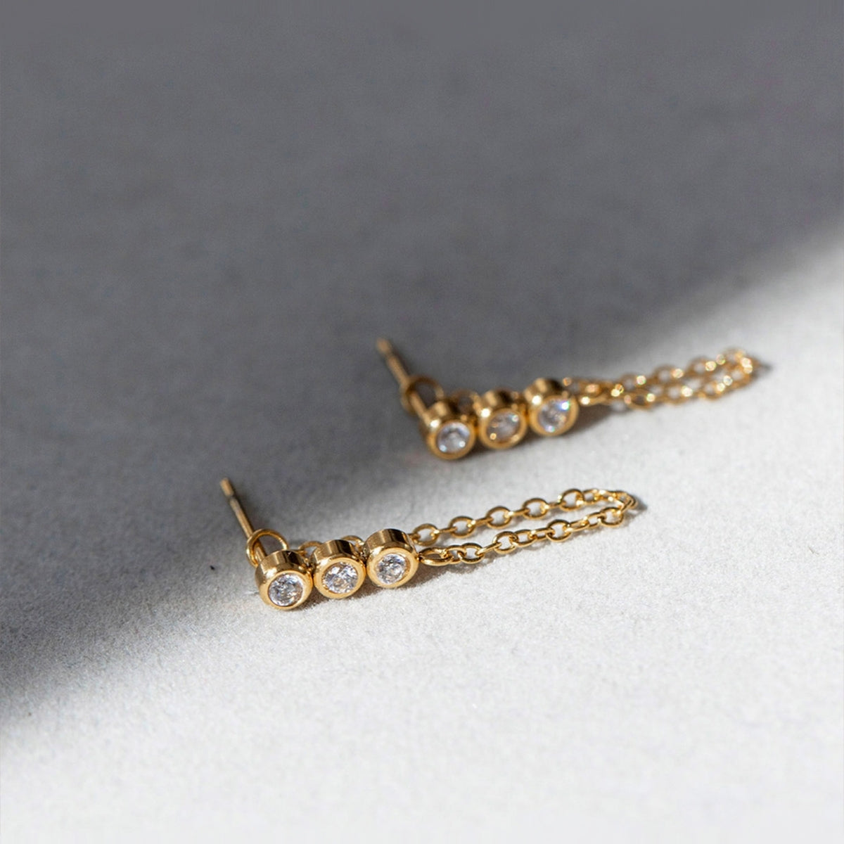 AEC Paris Leto Aventurine stud earrings on textured off white stone
