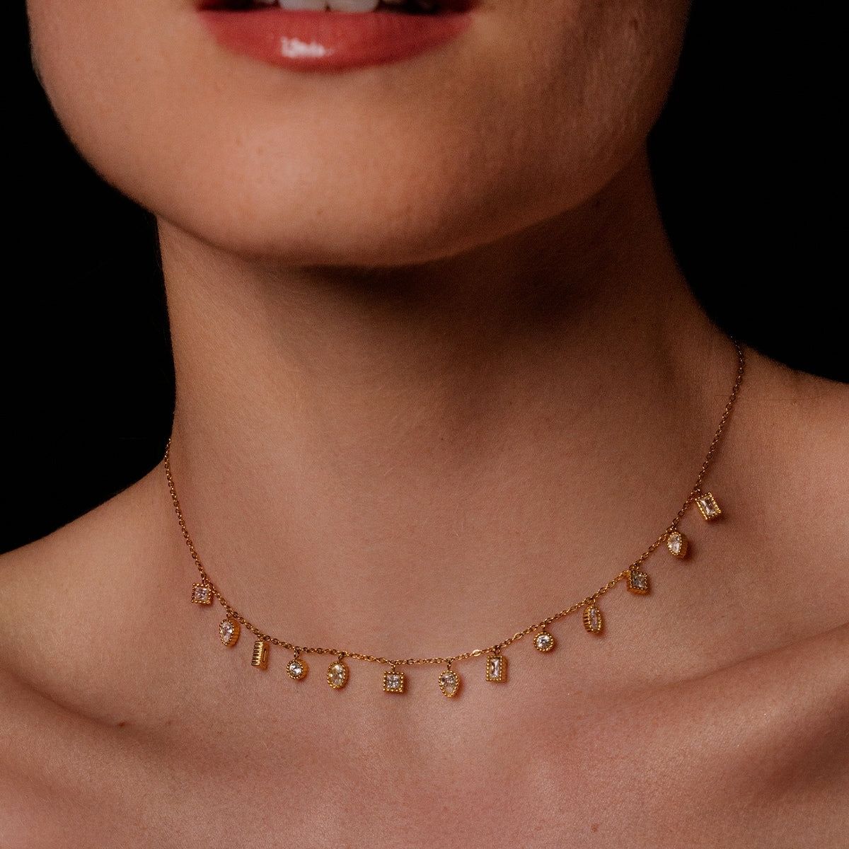 Close up of woman wearing AEC Paris Mohandas white zirconium oxide necklace 