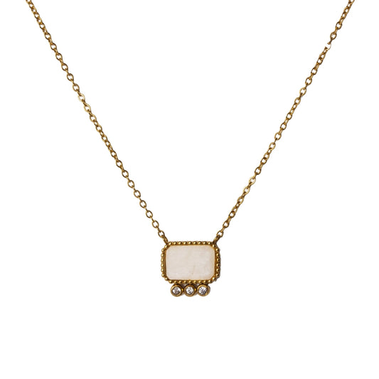 Upclose with the pendant from AEC Paris Thetis Moonstone necklace - gold chain necklace featuring a luminous moonstone baguette gemstone pendant, 14k gold-plated stainless-steel material, durable hypoallergenic everyday jewellery promoting emotional balance.