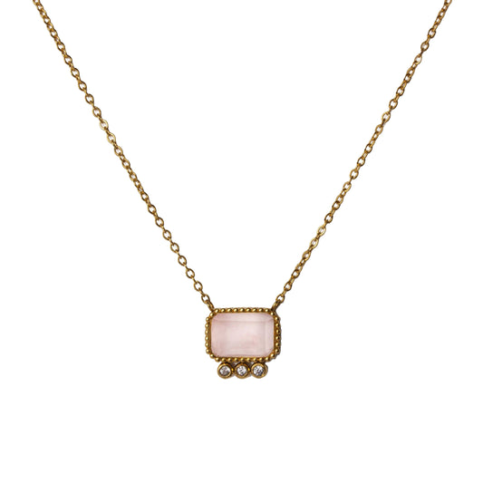 Upclose view with the pendant from AEC Paris Thetis Watermelon Quartz necklace - gold chain necklace featuring a pink-green watermelon quartz baguette gemstone pendant, 14k gold-plated stainless steel, durable hypoallergenic jewellery for everyday wear.