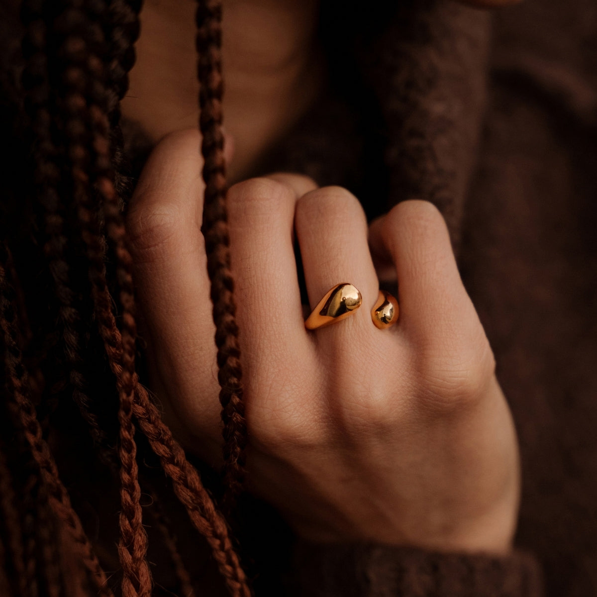 Close up of woman with plaits wearing AEC Paris Irene Gold size 5-7 ring 