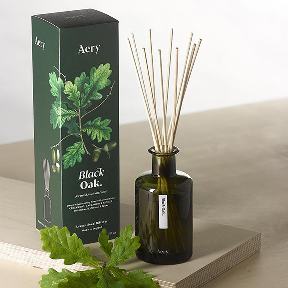 Aery Black Oak 200ml diffuser from the Botanical Green collection showing diffuser and packaging on wood