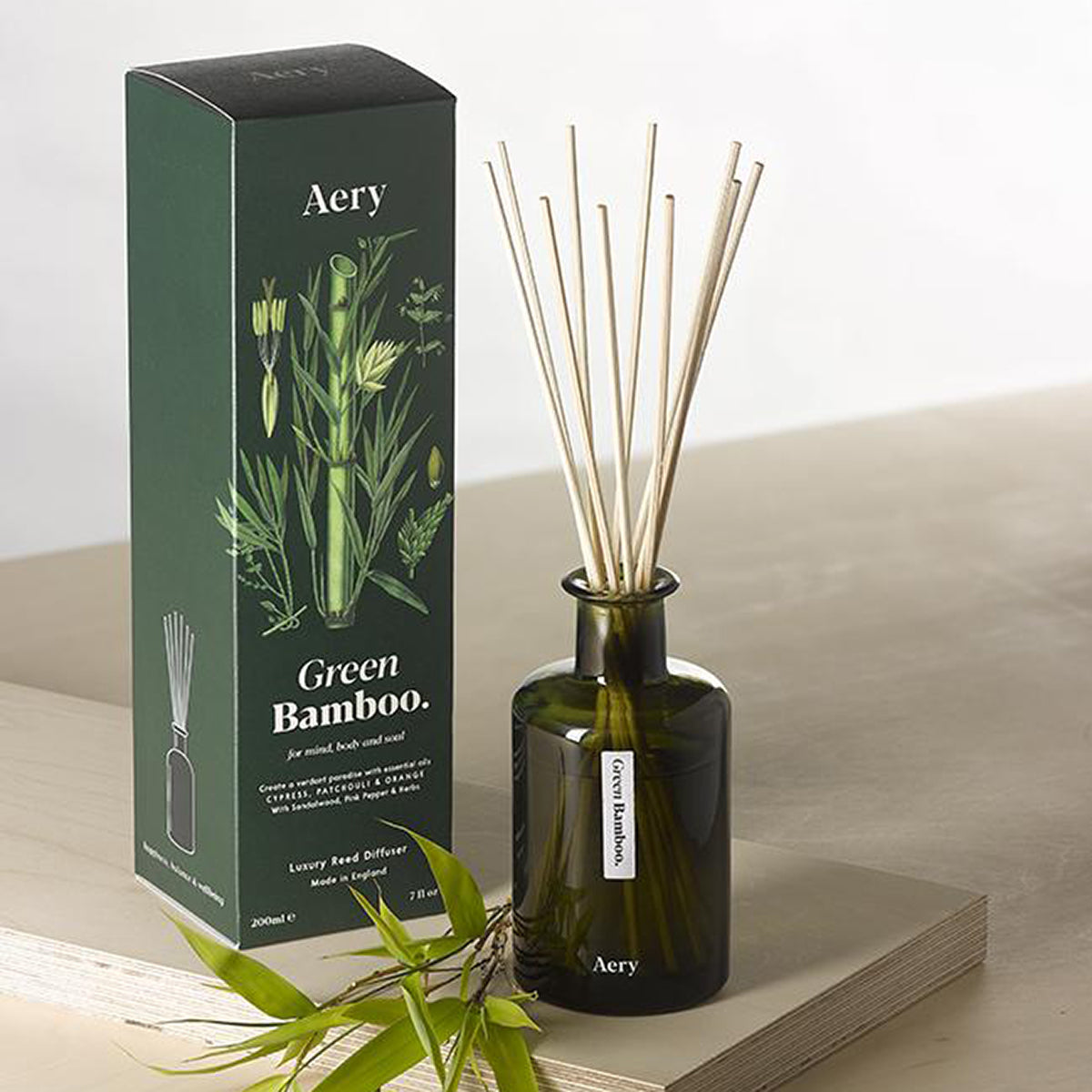 Aery Green Bamboo 200ml diffuser from the Botanical Green collection showing diffuser and packaging on wood