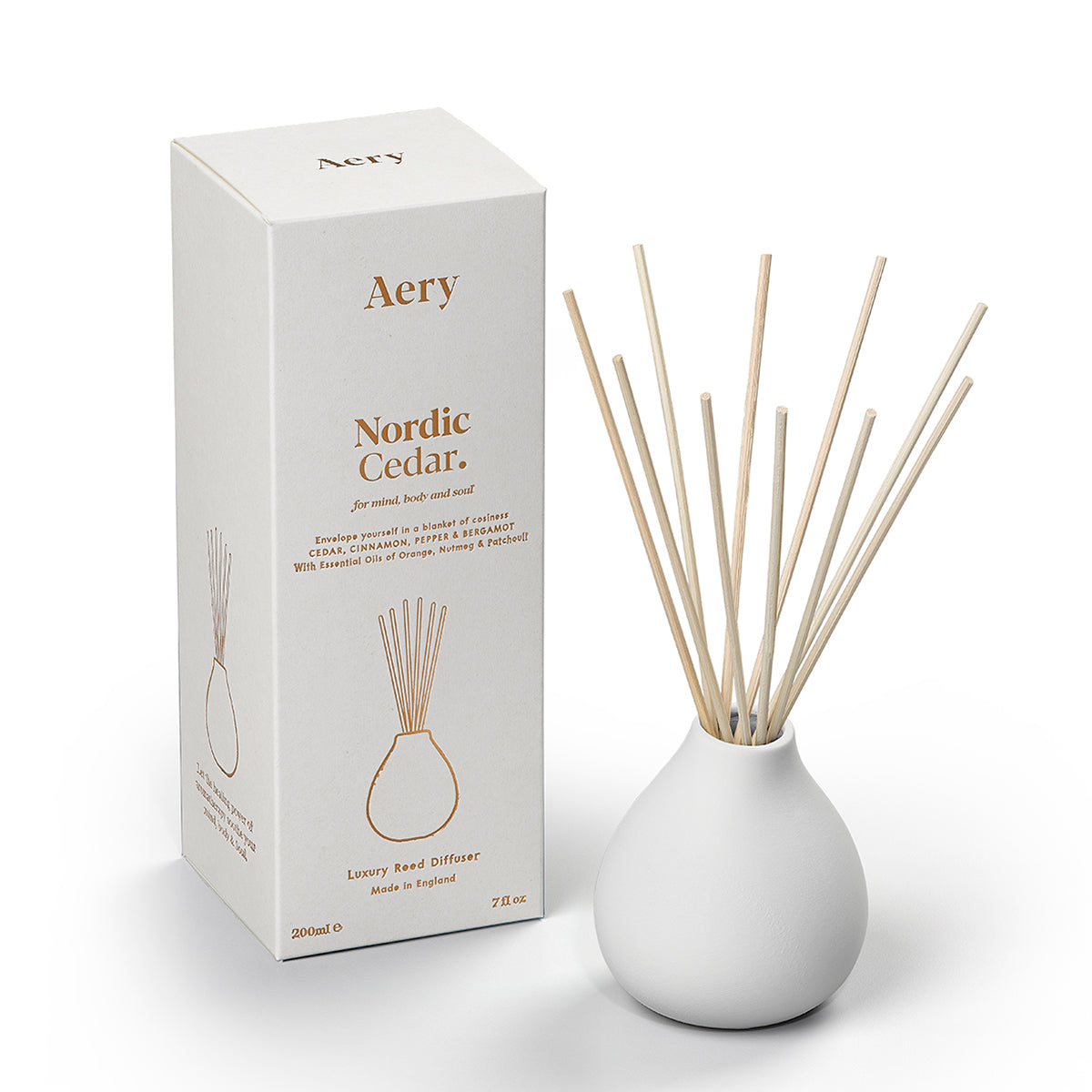 Aery Nordic Cedar 200ml diffuser from the Fernweh collection showing diffuser and packaging on white table with white sculpture