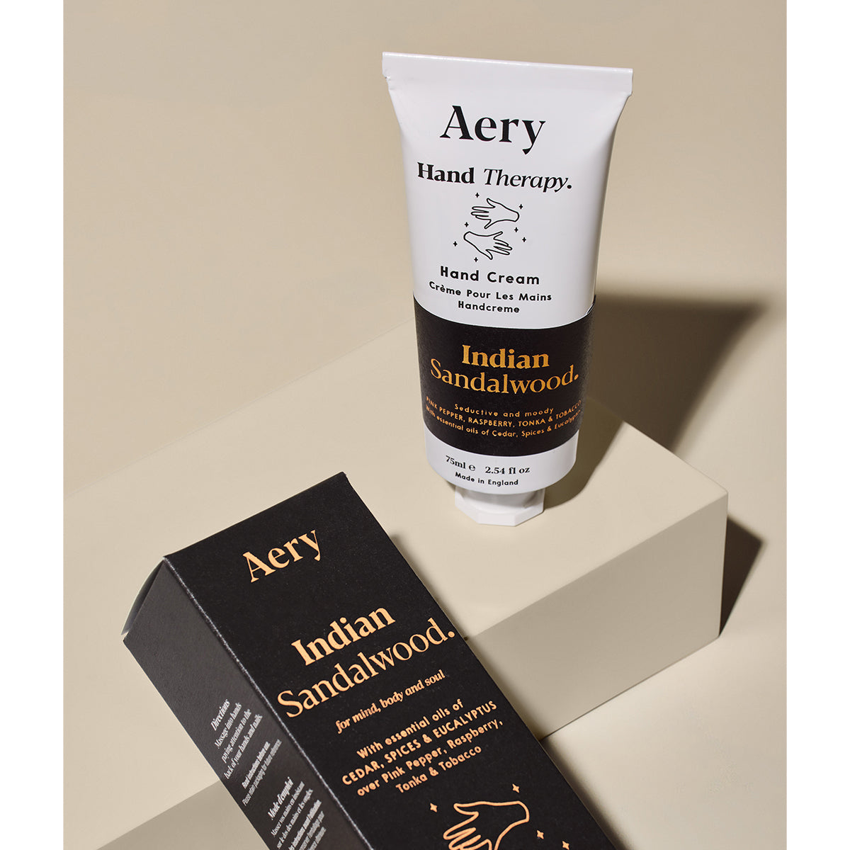 Aery 75ml Himalayan Cedarleaf hand cream from the Fernweh collection showing hand cream and packaging laying on beige background