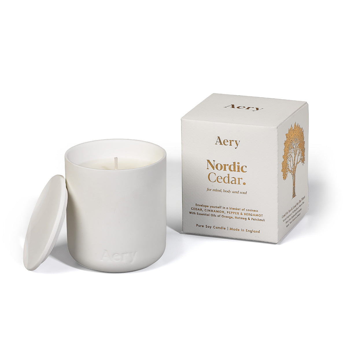 Aery Nordic Cedar 280gm candle with lid from the Fernweh collection and packaging on white backgrond