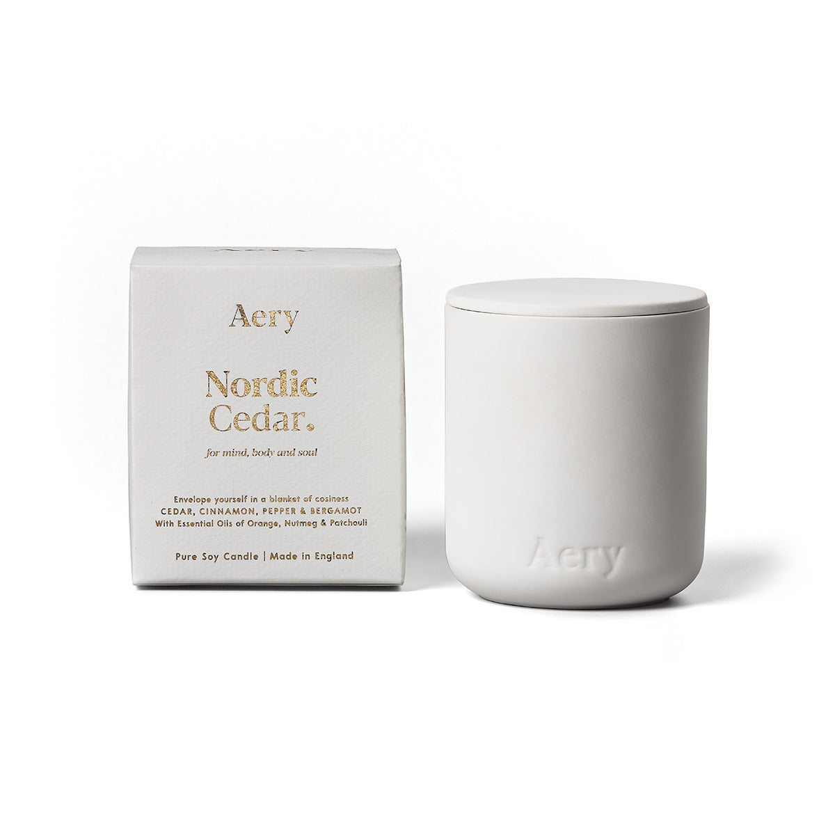 Aery Nordic Cedar 280gm candle with lid from the Fernweh collection and packaging on white backgrond