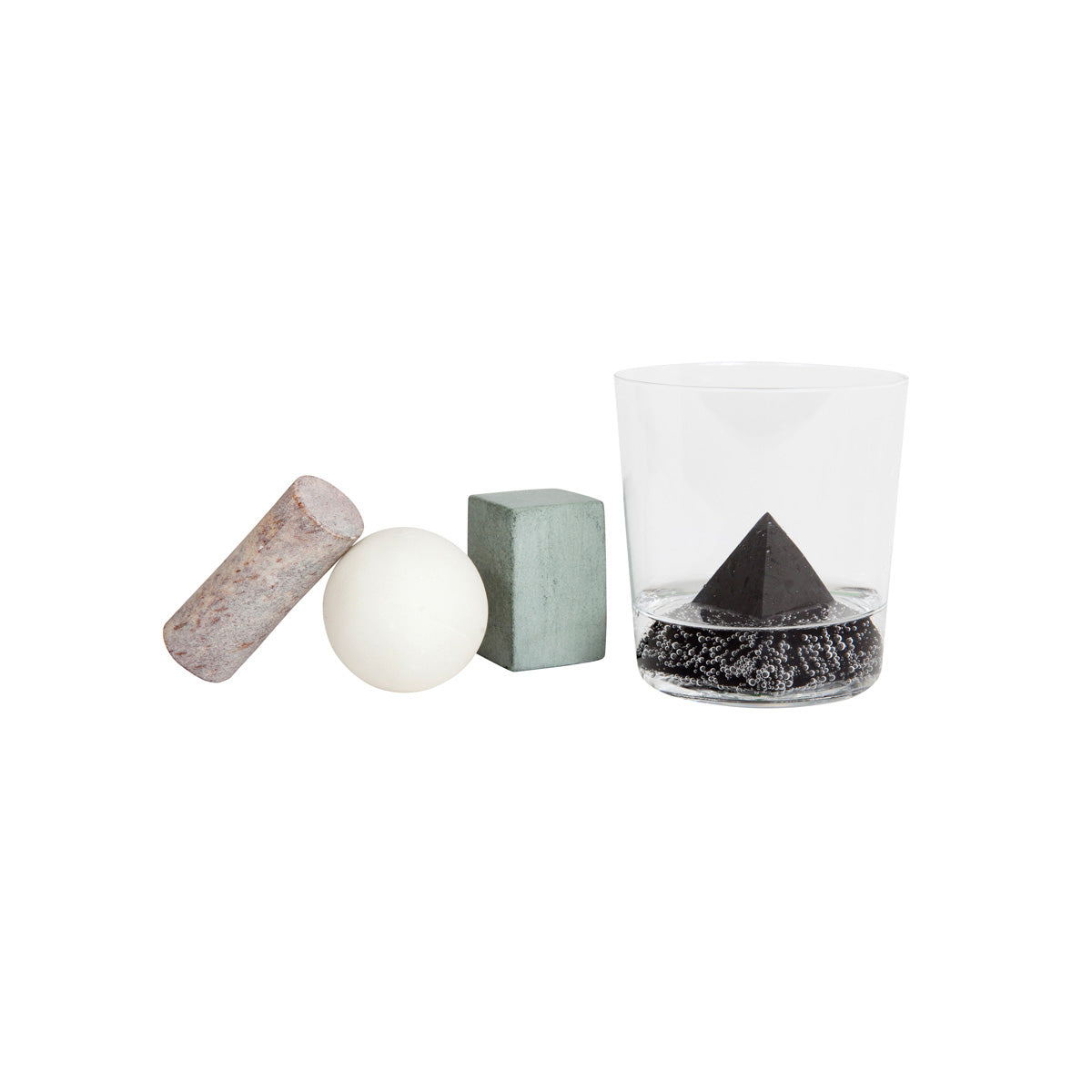 Areaware drink rock whiskey stones in cluster on white background with glass