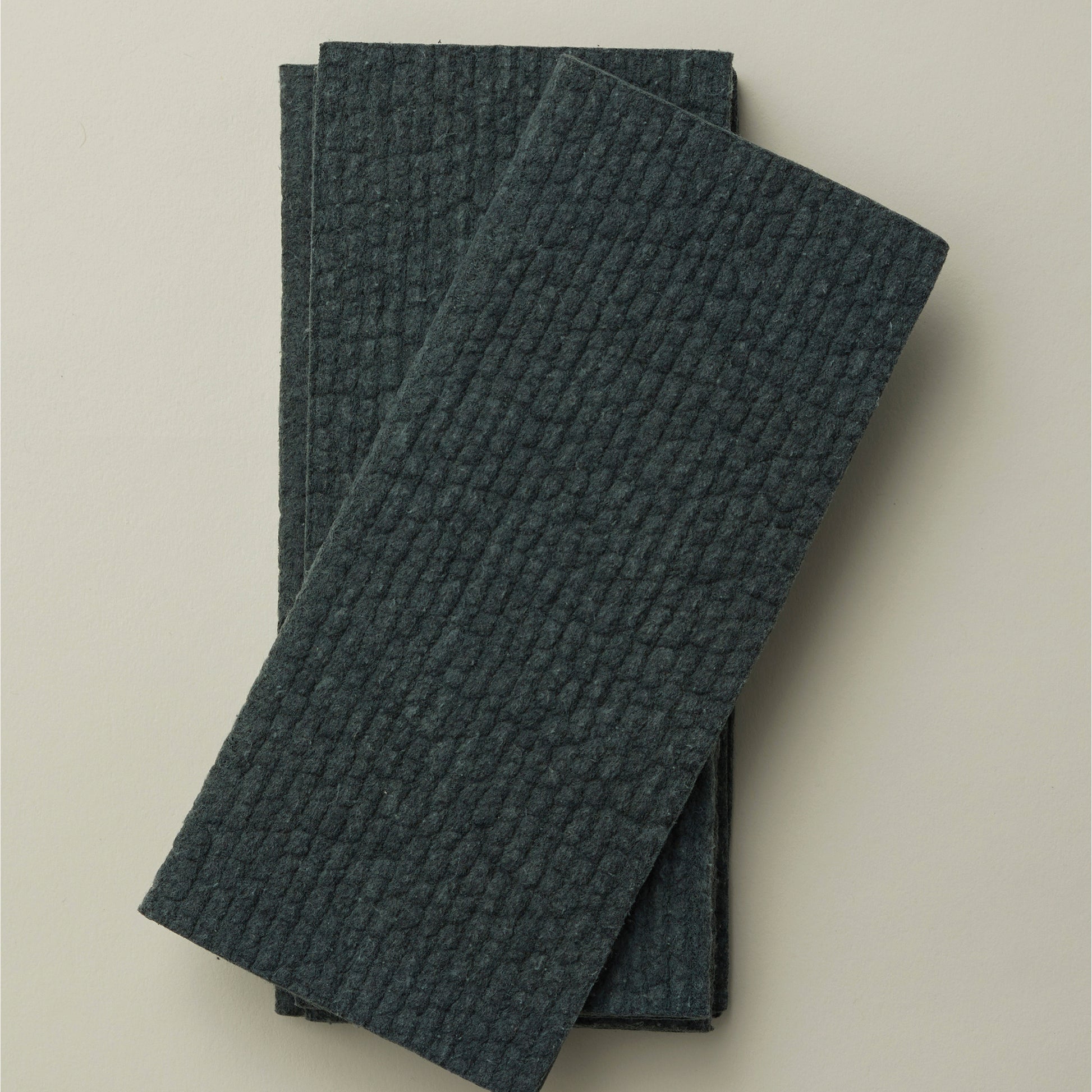 Close up of Ashley and Co 'Clean Buff' multipurpose cloths in dark grey colour.