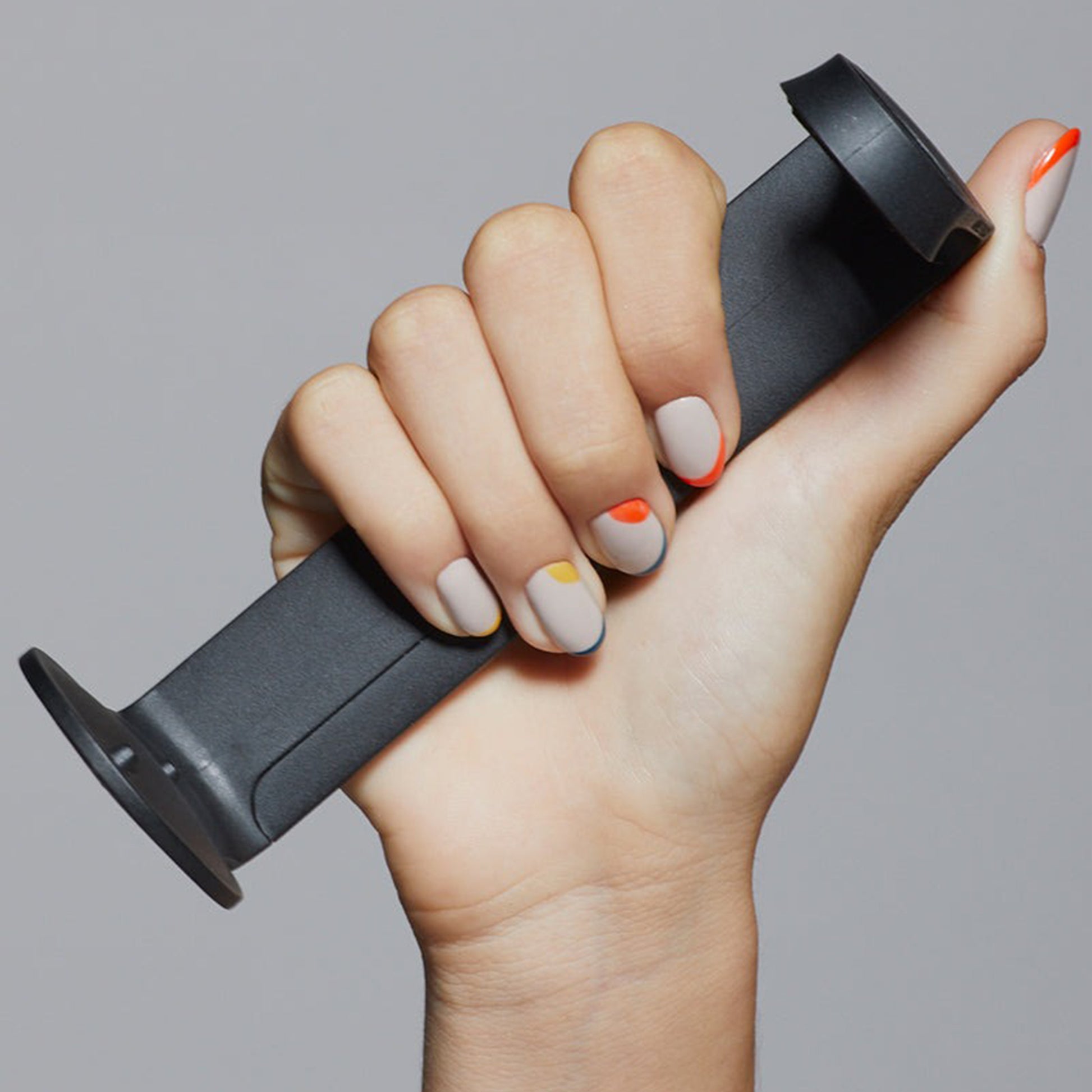 Ashley and Co 'hold me' wallmount shown held in a woman's hand.