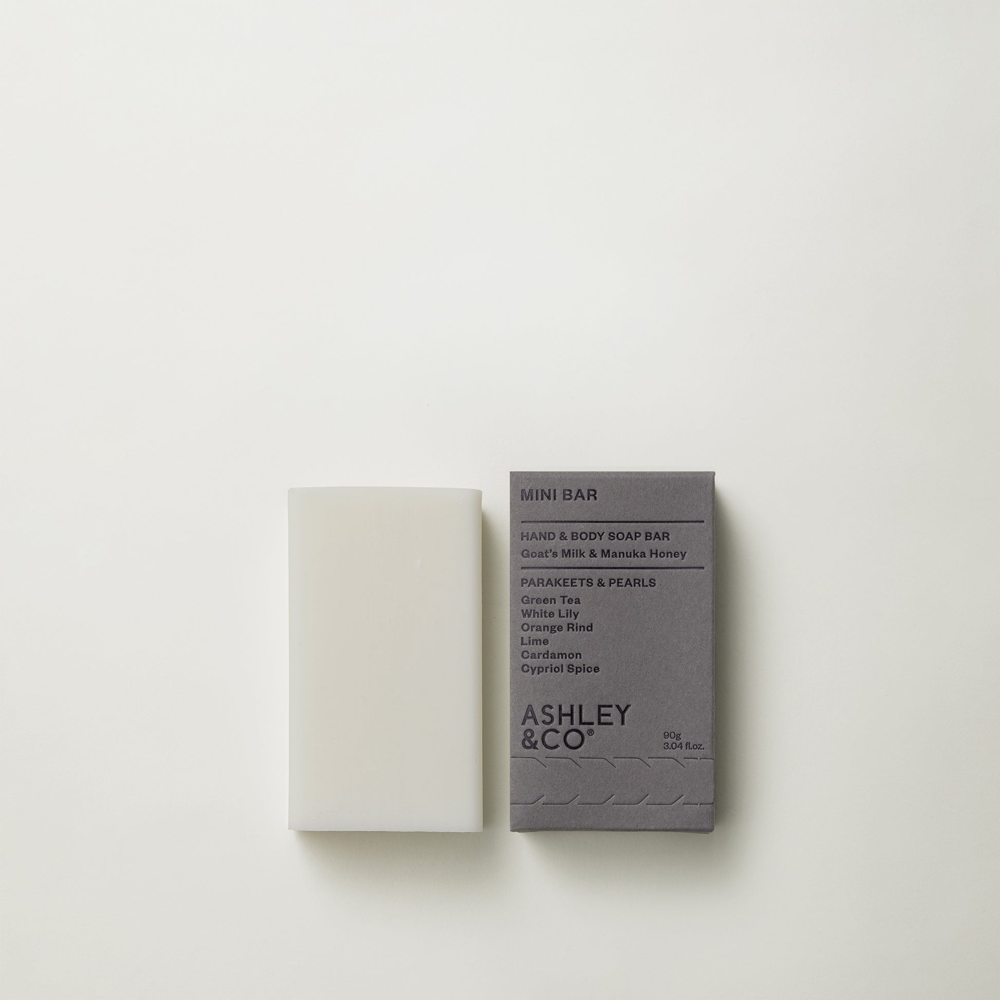 Ashley and Co 'Mini Bar' body soap in parakeets and pearls fragrance on a grey background.