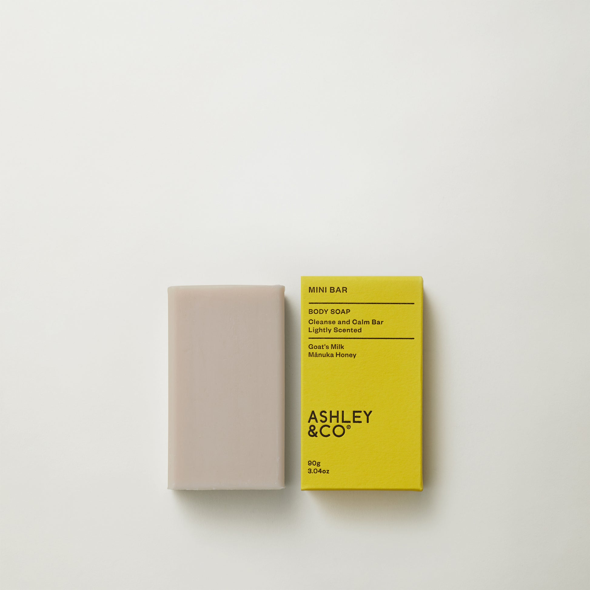 Ashley and Co 'Mini Bar' body soap in tui and kahili fragrance on a grey background.