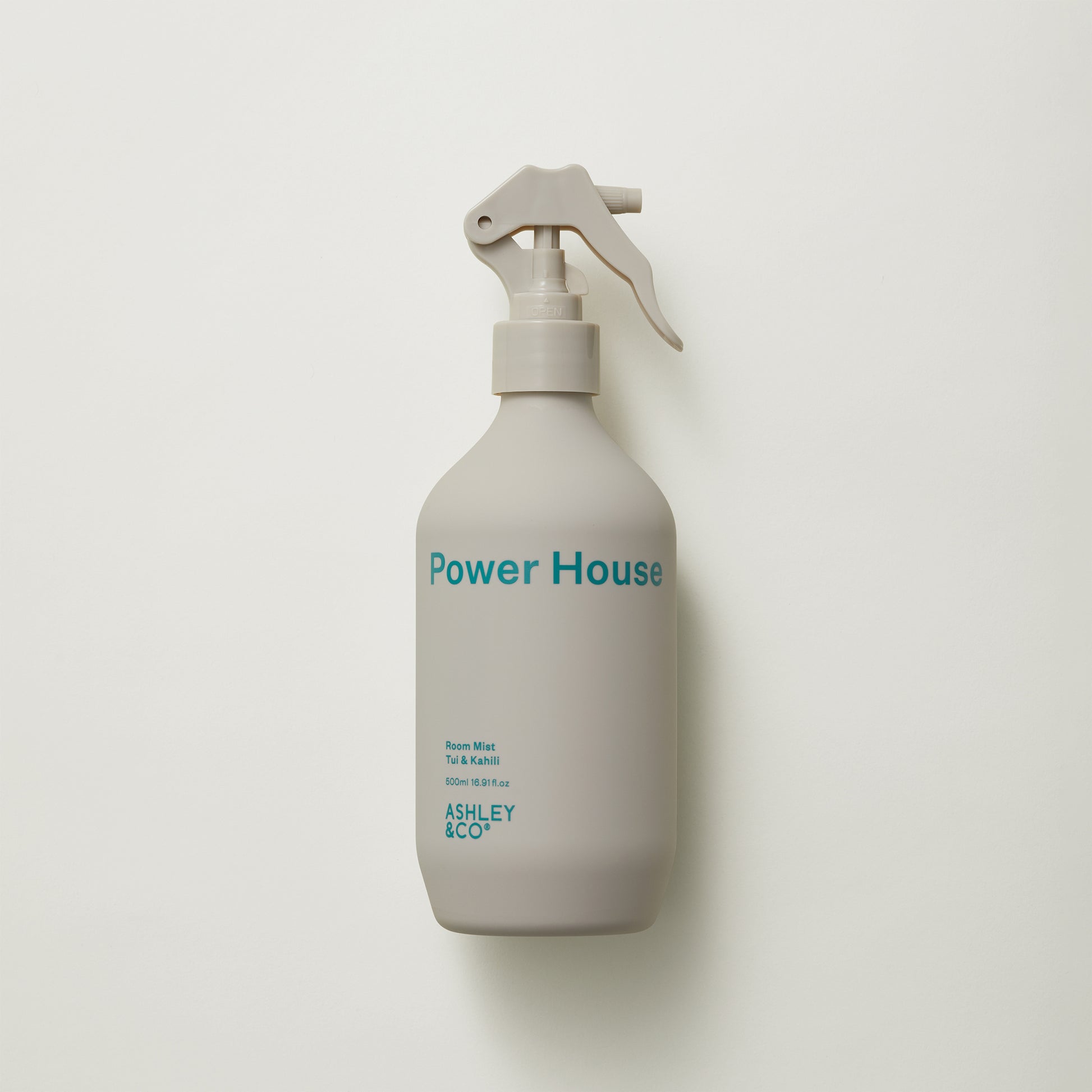 Ashley and Co 'Power House' room mist in tui and kahili fragrance on a grey background.