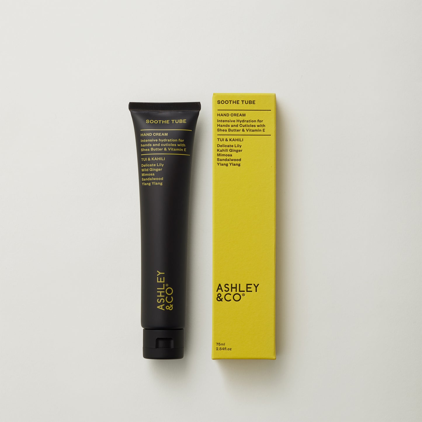 Ashley and Co 'Soothe Tube' handcream in tui and kahili fragrance on grey background.
