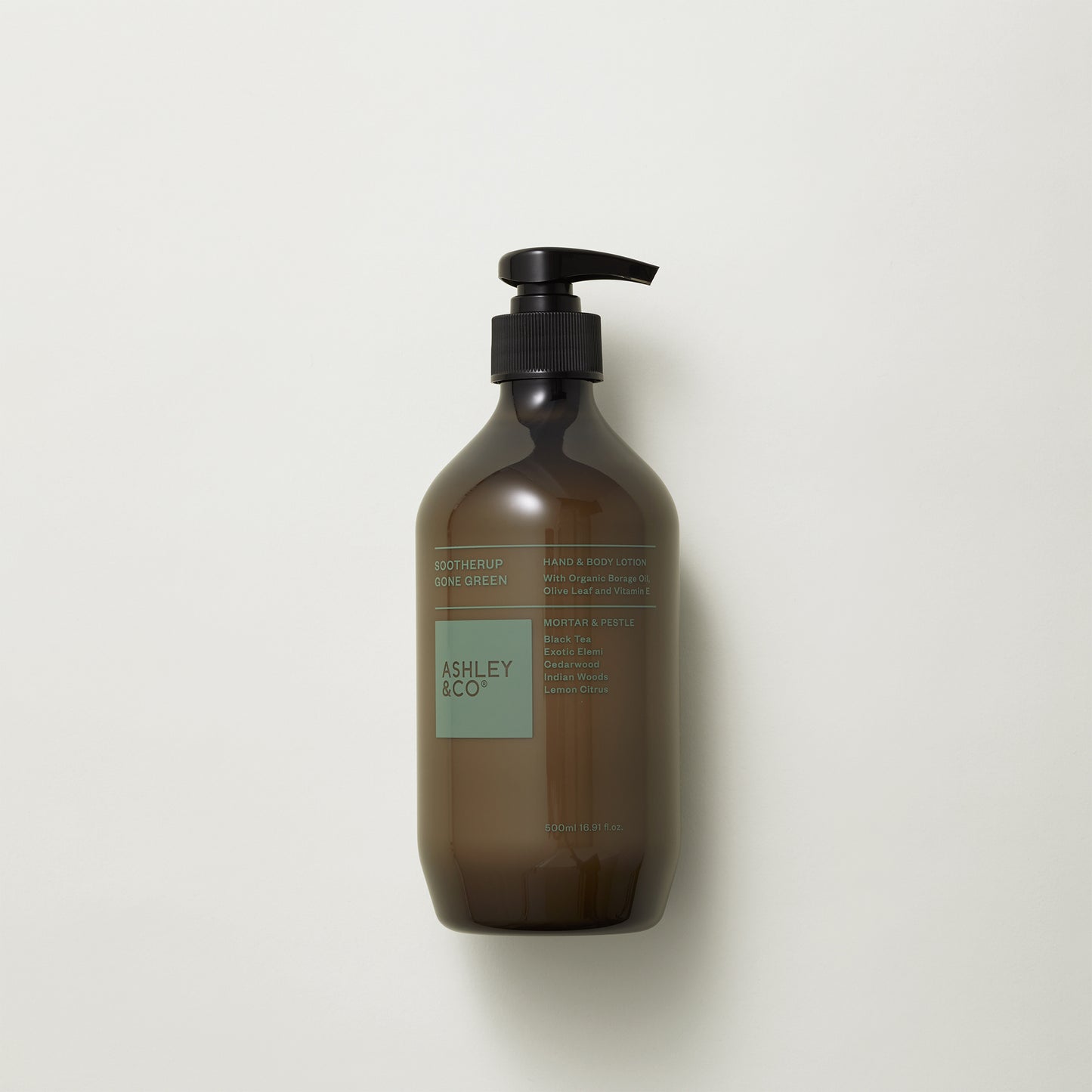 Ashley and Co 'Sootherup Gone Green' hand and body lotion in mortar and pestle fragrance on grey background.