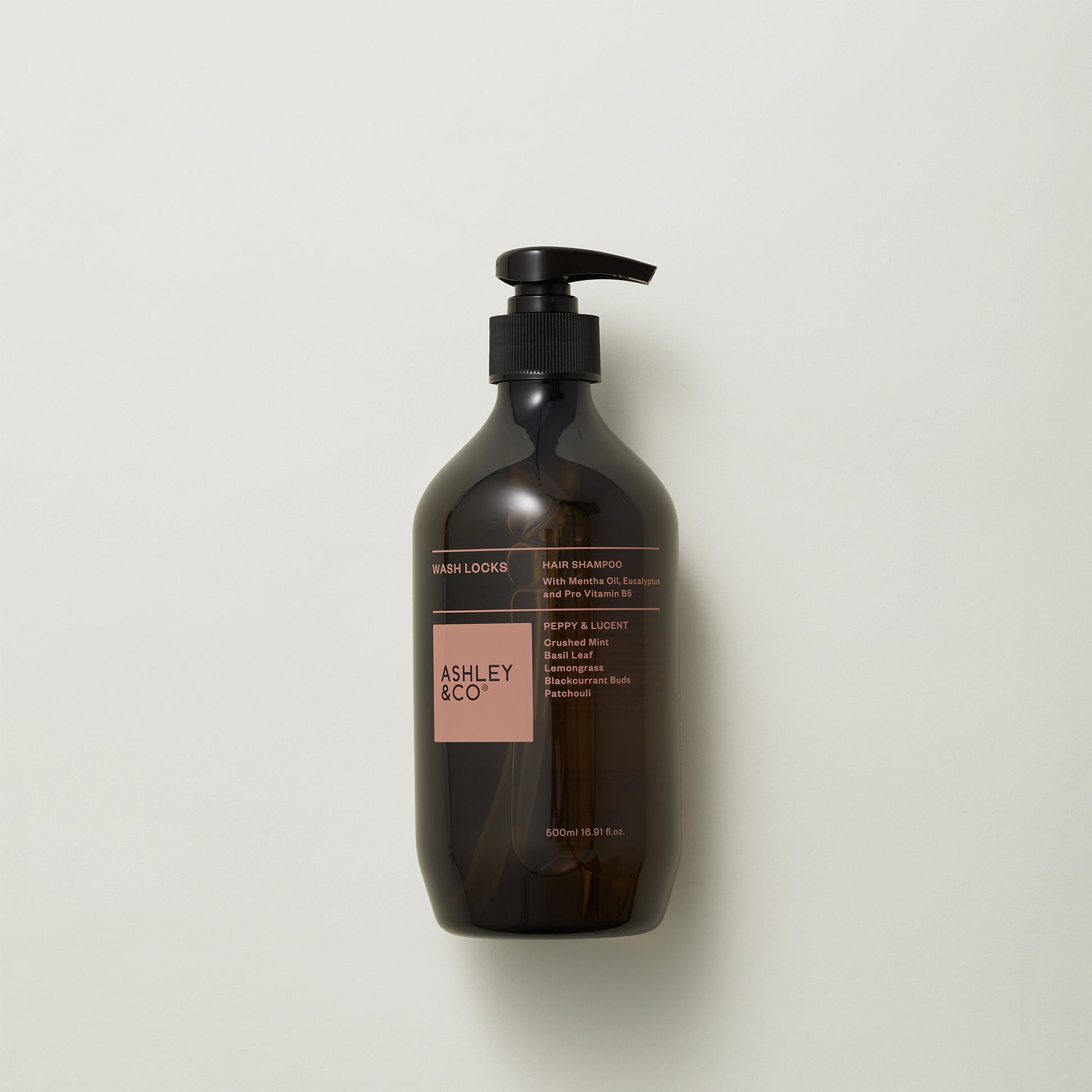 Ashley and Co "Wash Locks' hair shampoo in Peppy and Lucent scent on a grey background.